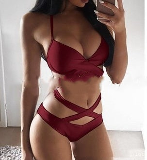 Woman wearing a red lingerie set indoors.