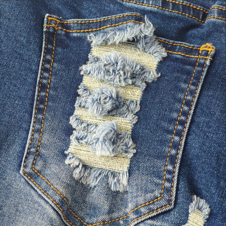 Trendsi American flag denim shorts back pocket closeup with distressed frayed striped patch detail
