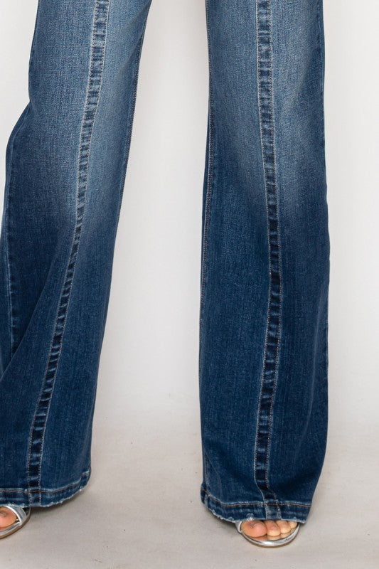 Artemis Vintage Relaxed Flared Jeans medium wash full length flared legs with open toe sandals