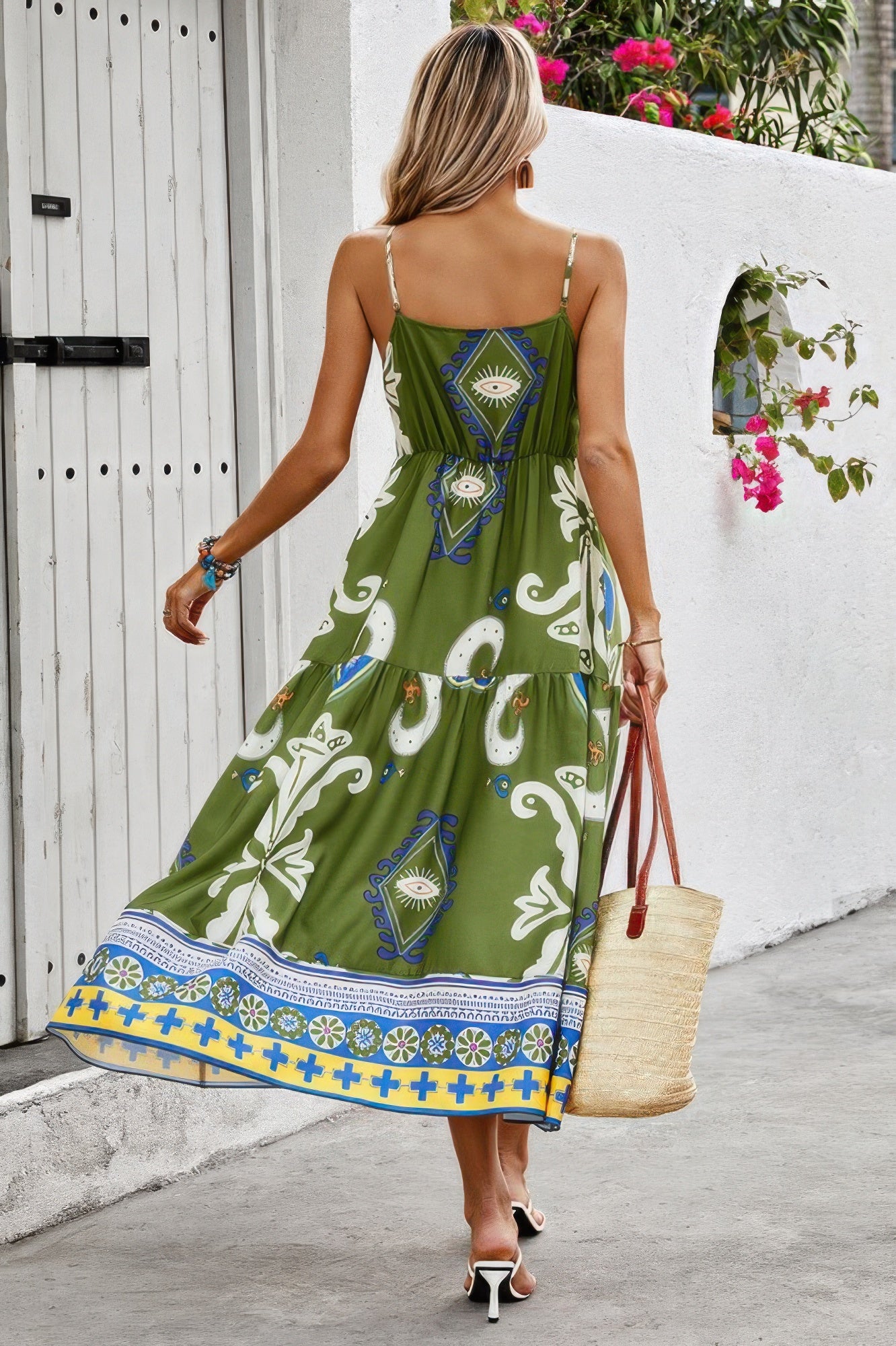 Back view CCWHOLESALECLOTHING green boho Spaghetti Strap Dress with paisley print tiered skirt and straw tote for summer