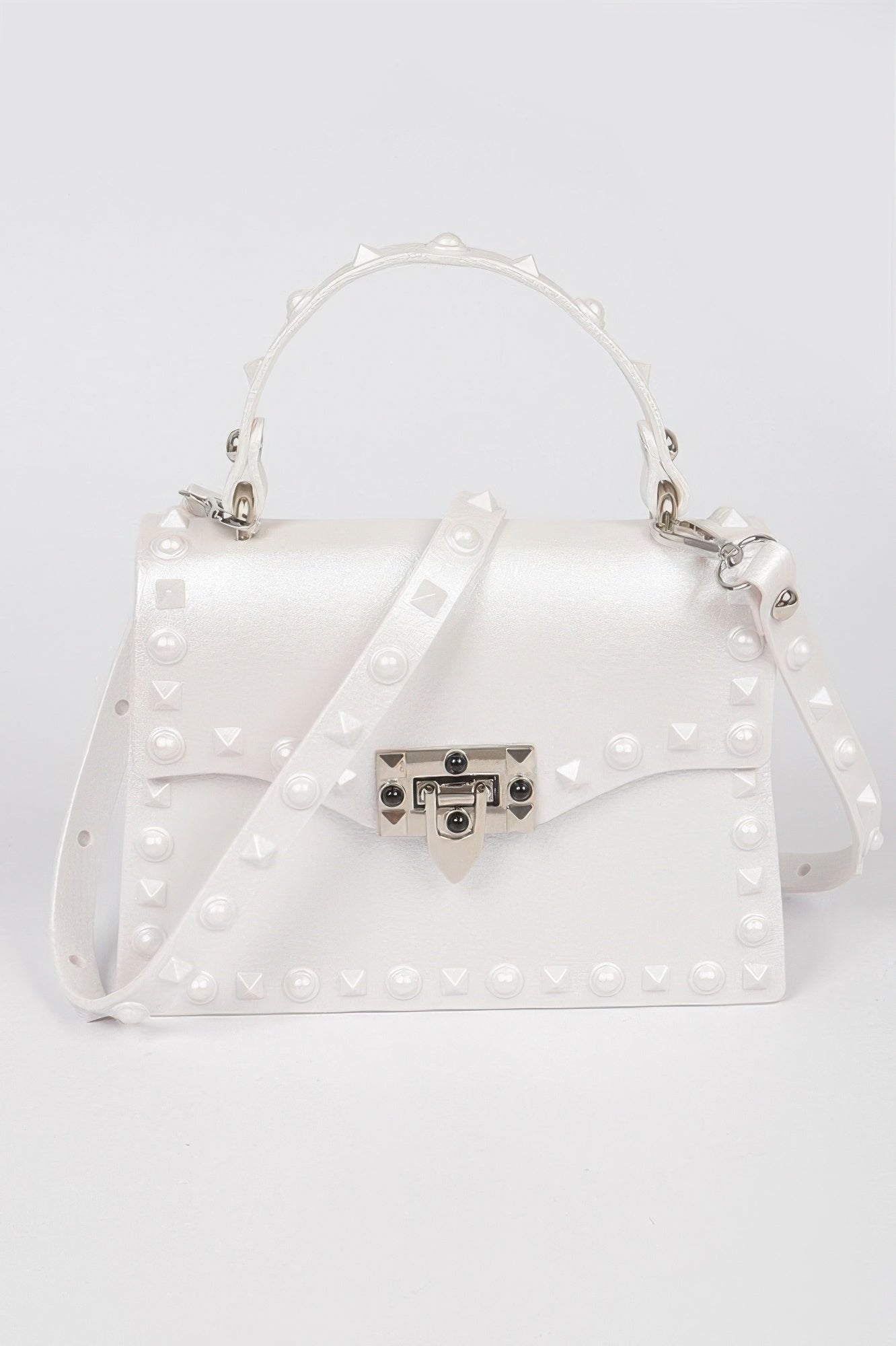 Monotone Studded Clutch white boxy handbag with top handle detachable shoulder strap pyramid studs and silver lock