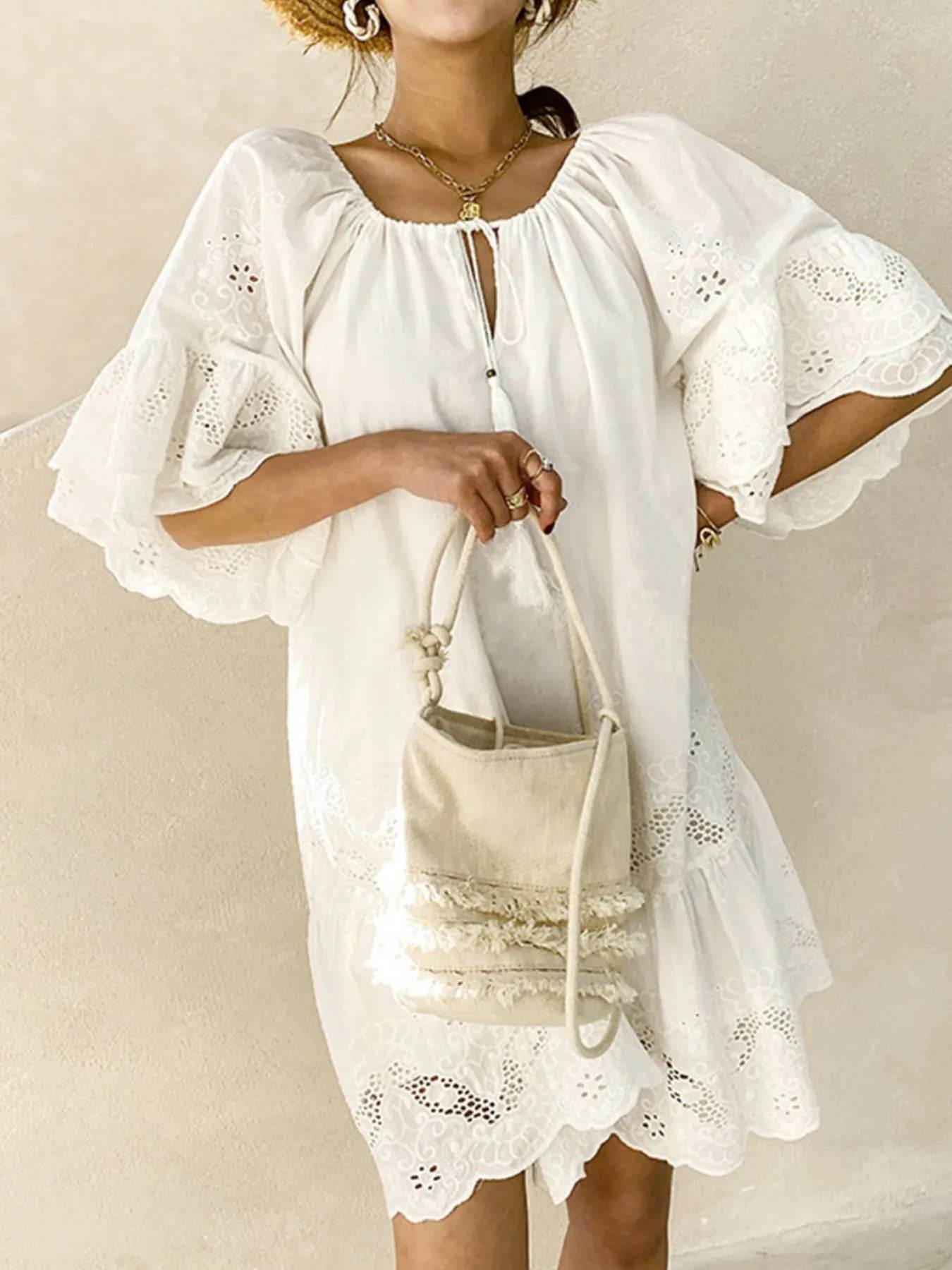 Eyelet Embroidered Tassel Tie Neck Dress - Boho Mini Dress - Fashions Envy