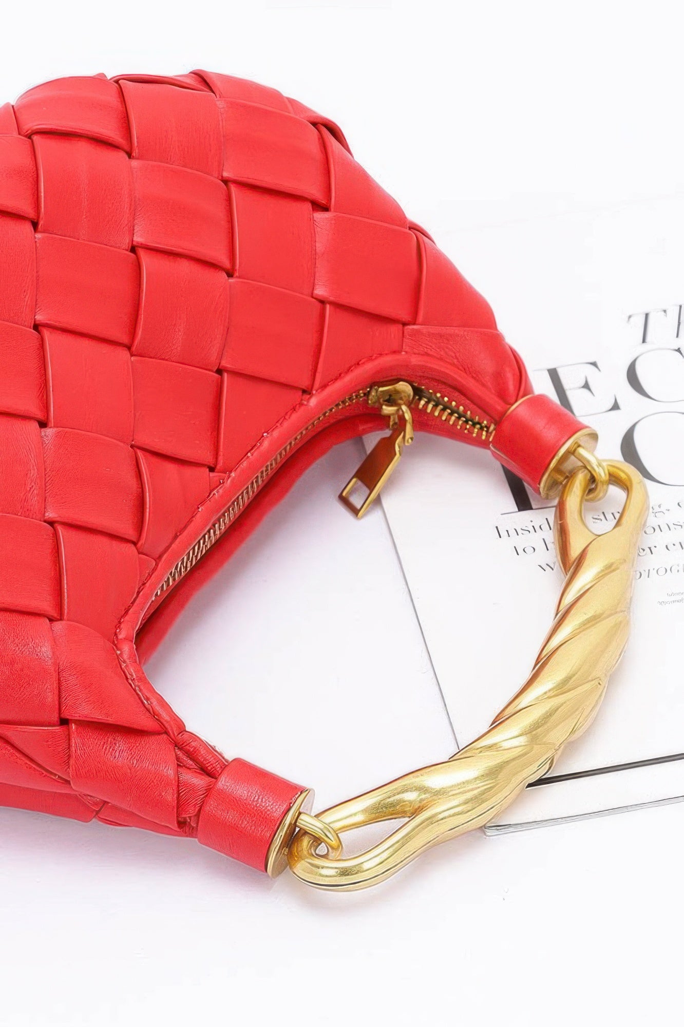 Red woven faux leather braided handle bag with gold twisted handle and zip closure