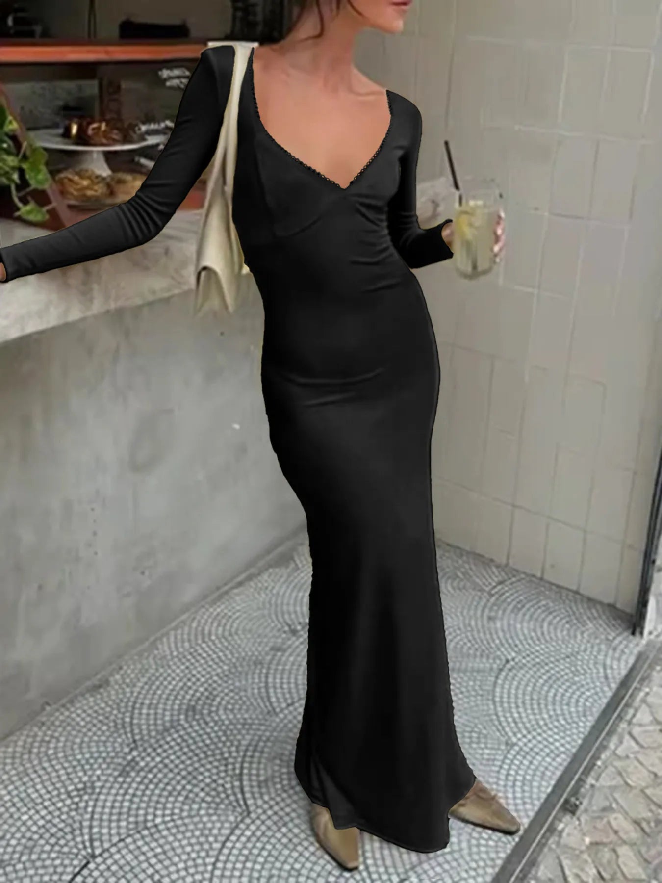Trendsi Figure-Hugging Evening Dress black long sleeve V-neck floor-length fitted gown with beige shoulder bag and gold heels
