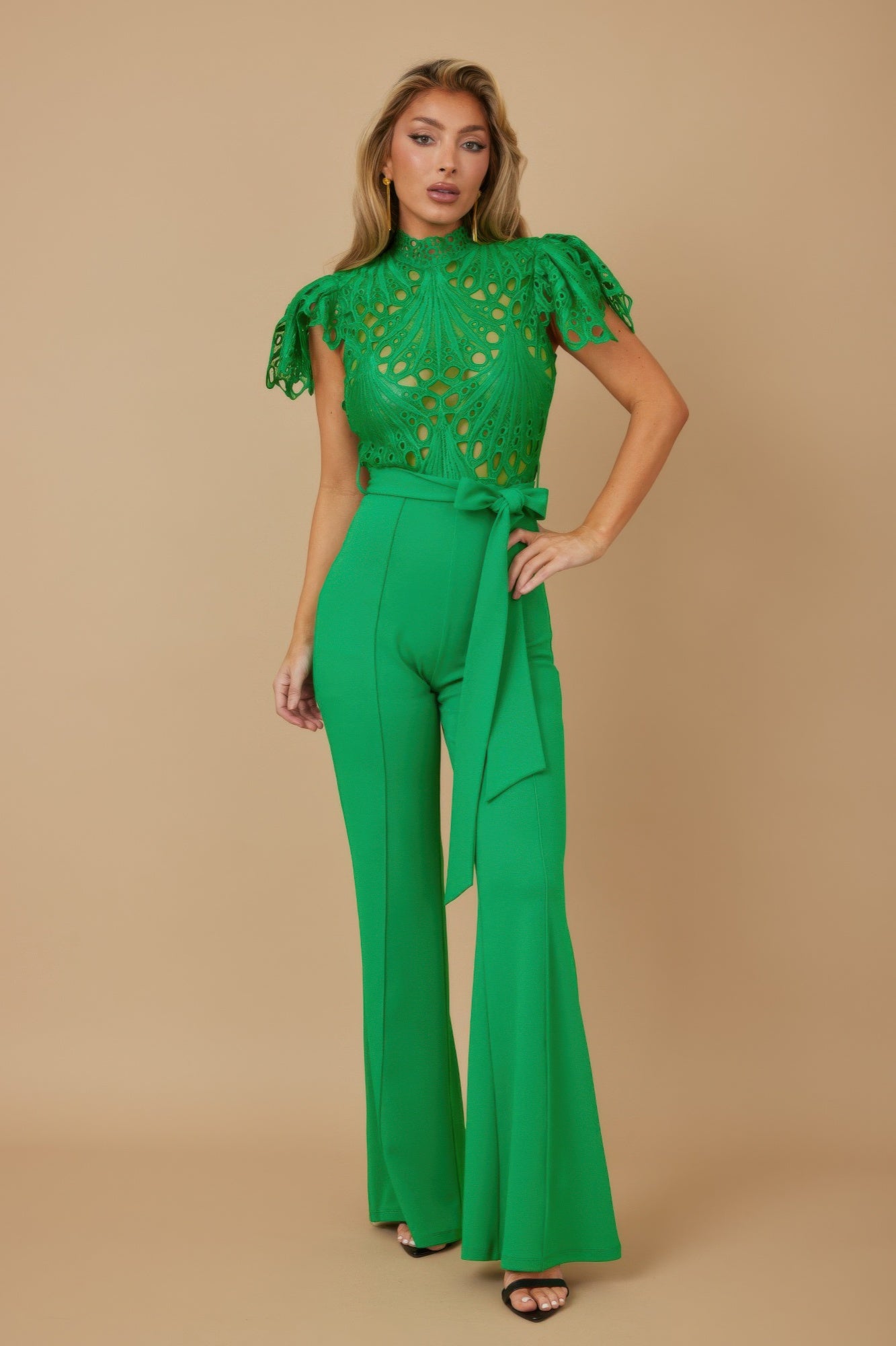 Green high neck crochet jumpsuit for women with scalloped cap sleeves belted waist and flared legs