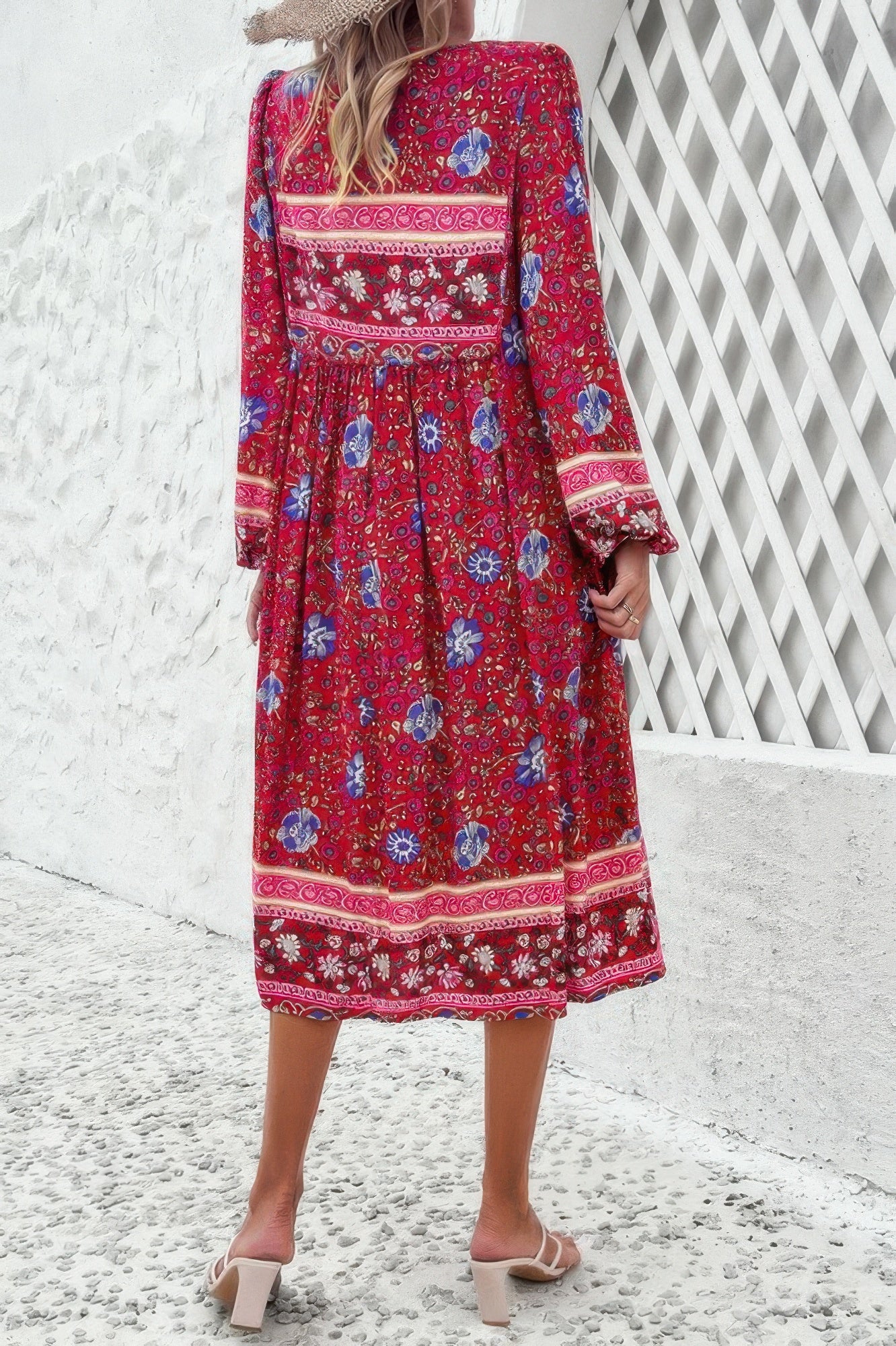 Back view of woman in CCWHOLESALECLOTHING red boho midi floral print v neck dress with long sleeves