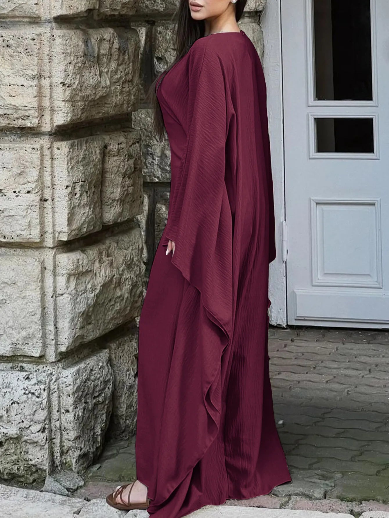 Trendsi burgundy bohemian maxi dress with cape sleeves worn by model in flowy long silhouette