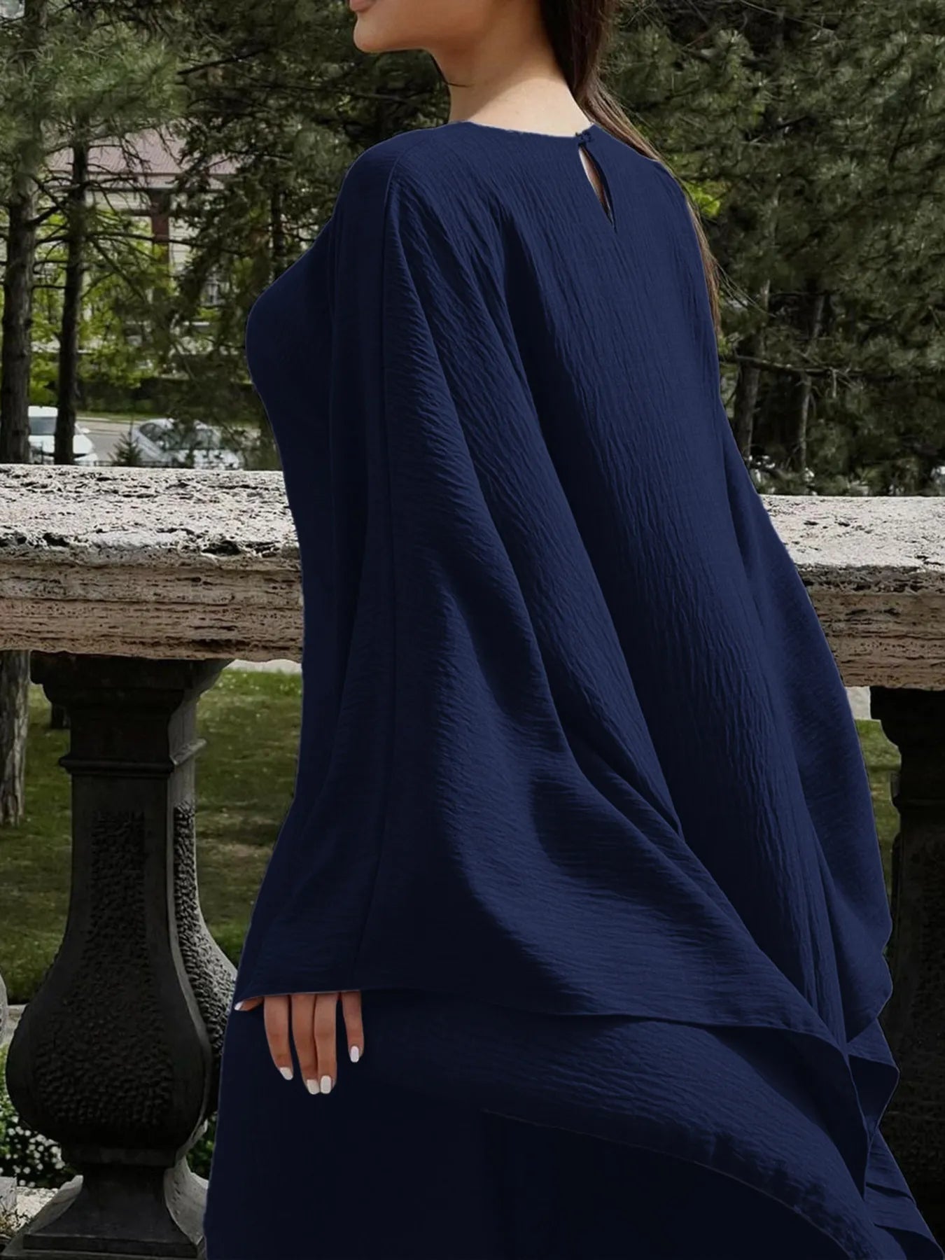 Trendsi navy bohemian maxi dress with cape sleeves textured fabric flowy silhouette back view