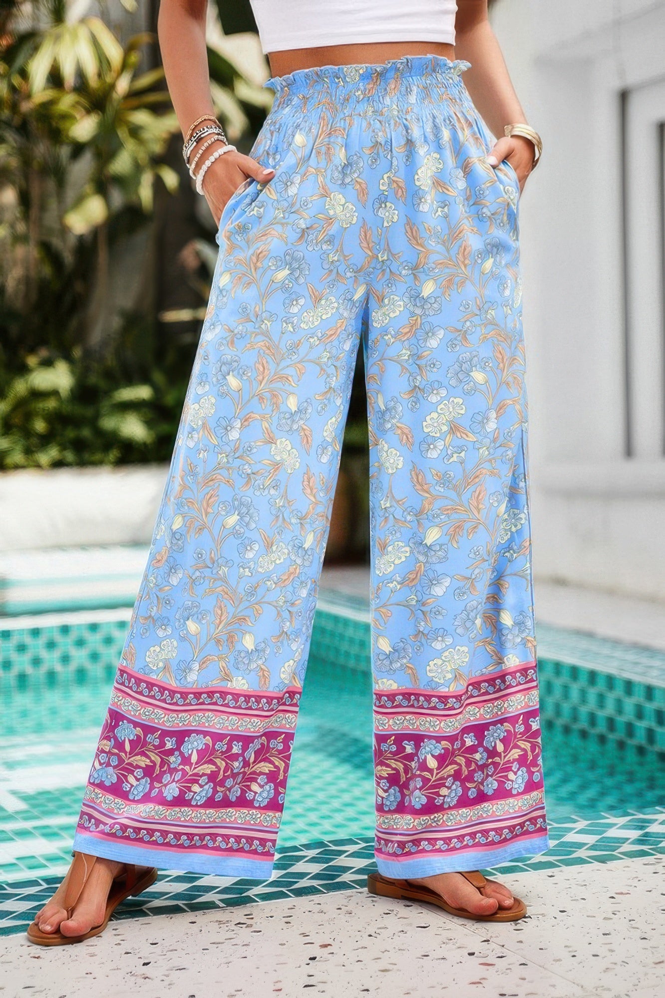 CCWHOLESALECLOTHING light blue floral wide leg pants for women with elastic smocked waist pockets and pink border hem