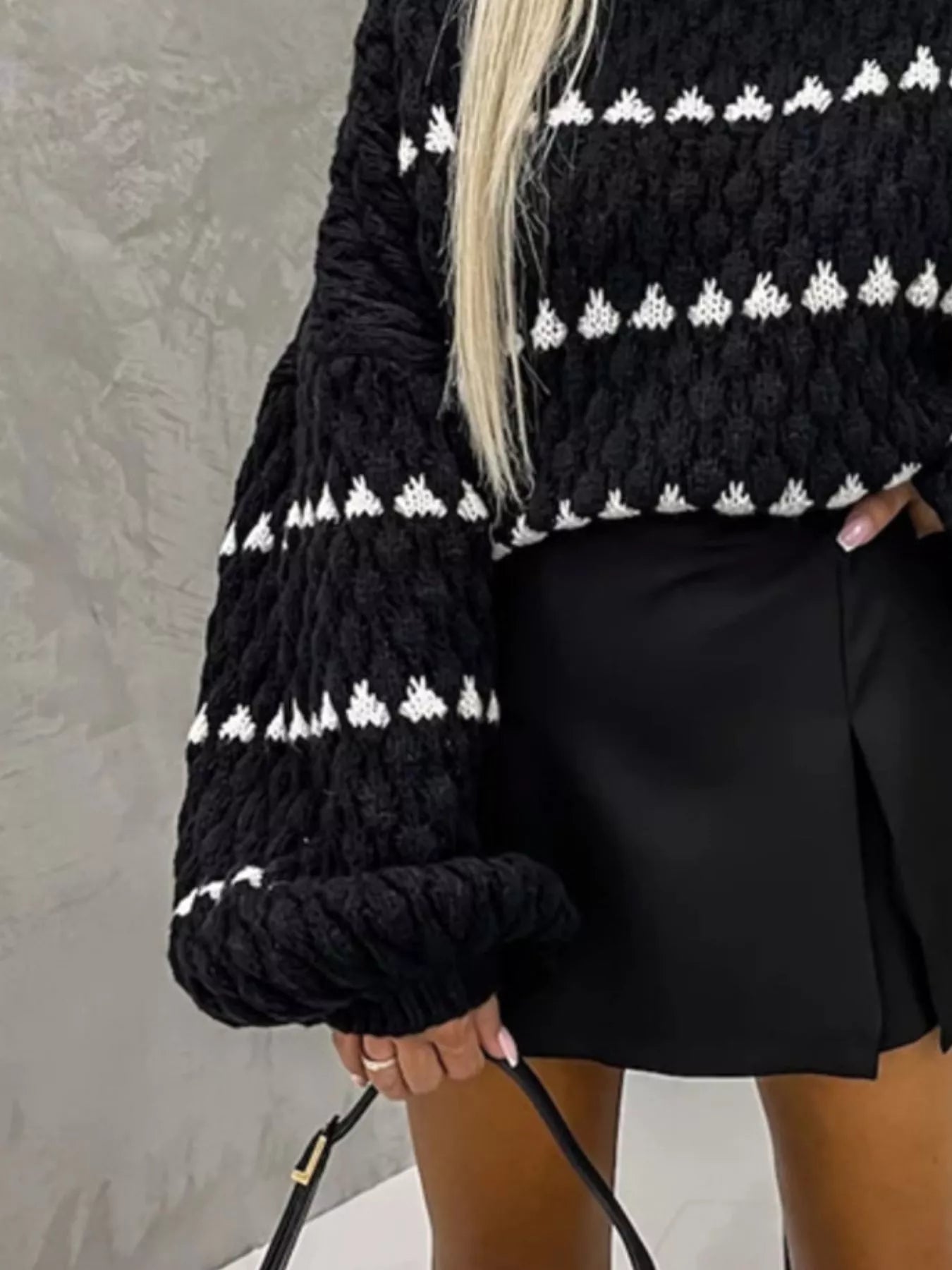 Chunky Knit Striped Sweater in black and white paired with a stylish black skirt
