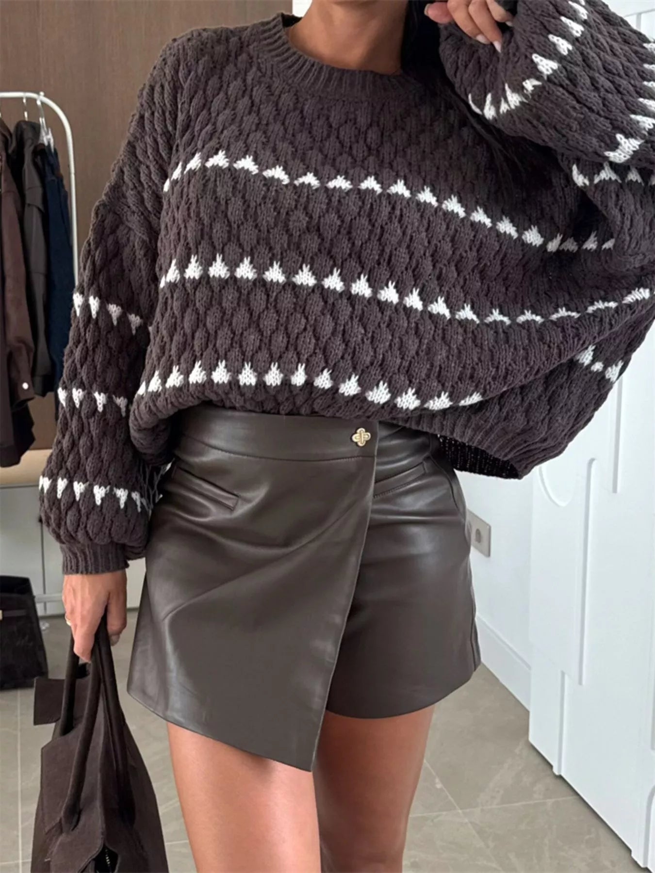 Chunky Knit Striped Sweater in dark brown and white paired with a chic leather skirt