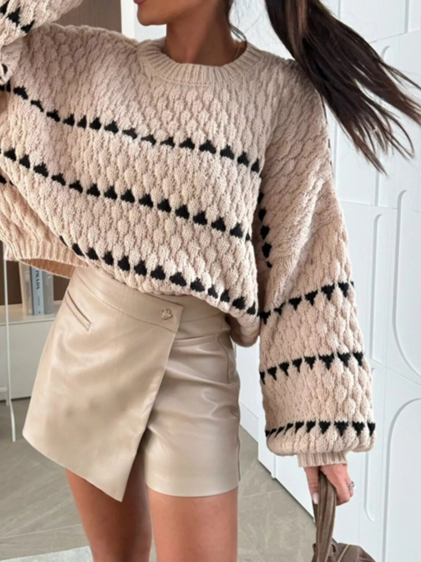 Trendsi Chunky Knit Striped Sweater in beige with black stripes, paired with a stylish mini skirt
