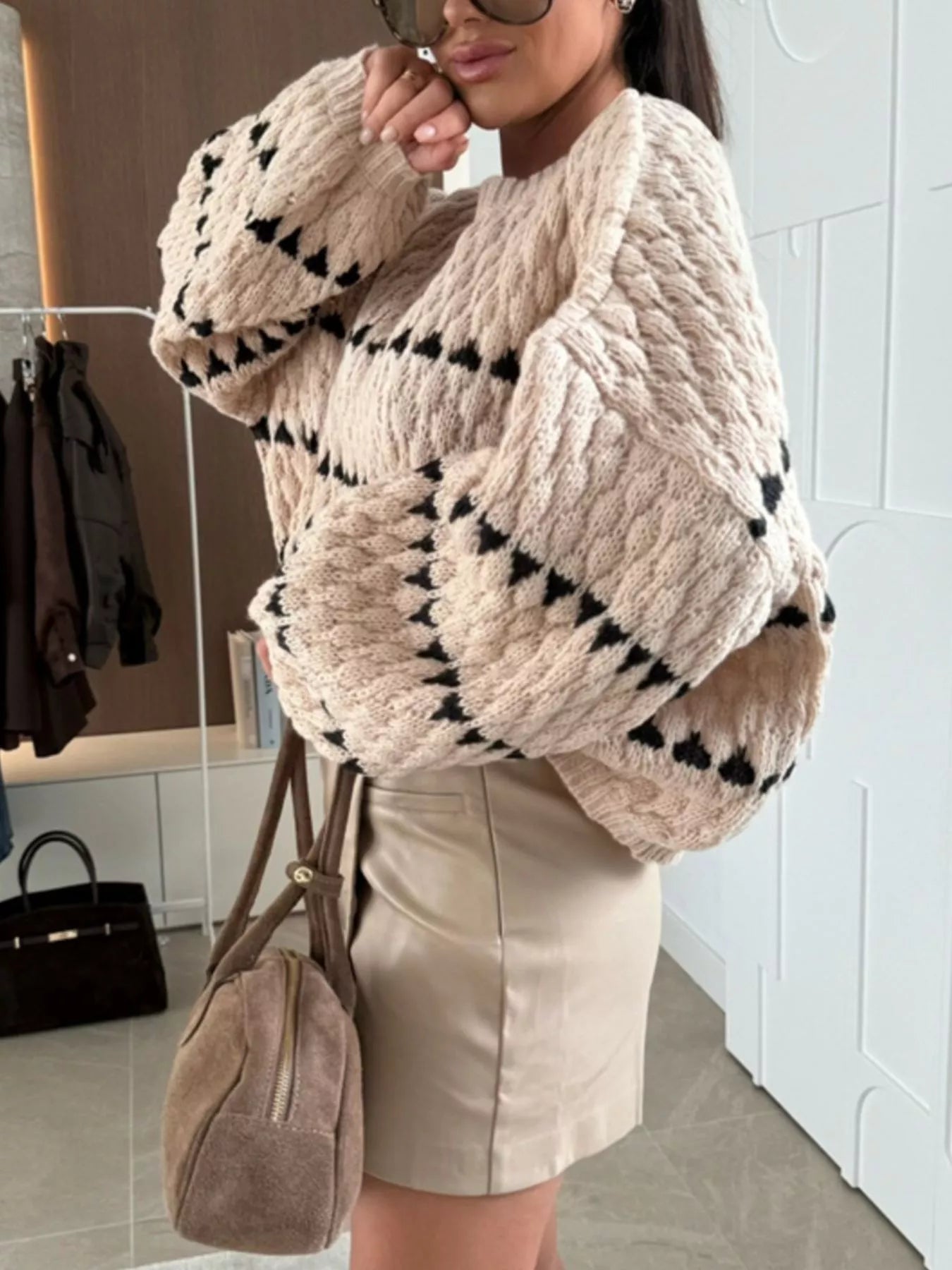 Trendsi Chunky Knit Striped Sweater in beige with black patterns, paired with a stylish skirt