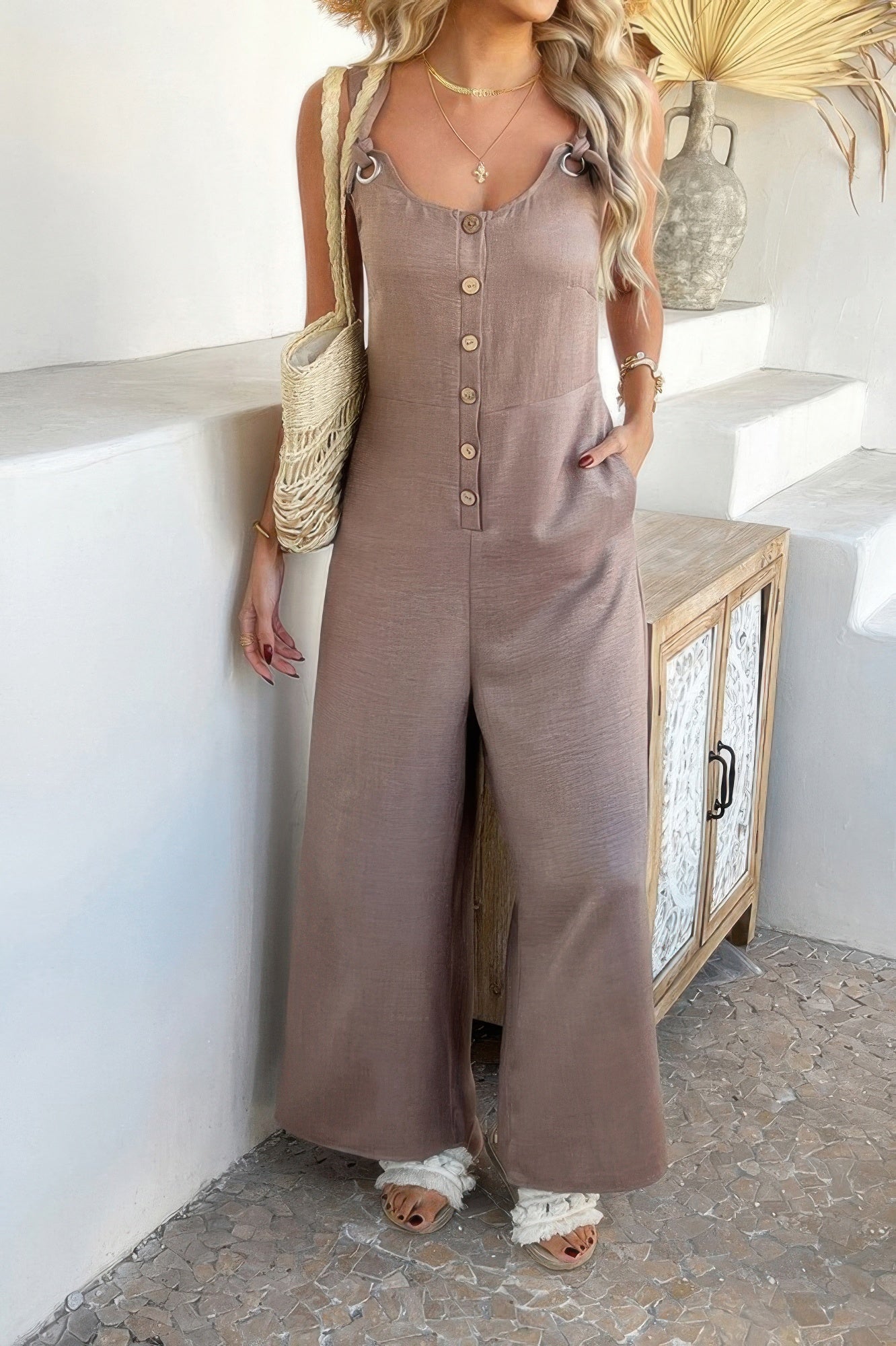Wide Leg Jumpsuit taupe sleeveless button front with ring straps side pockets styled with straw bag and sandals
