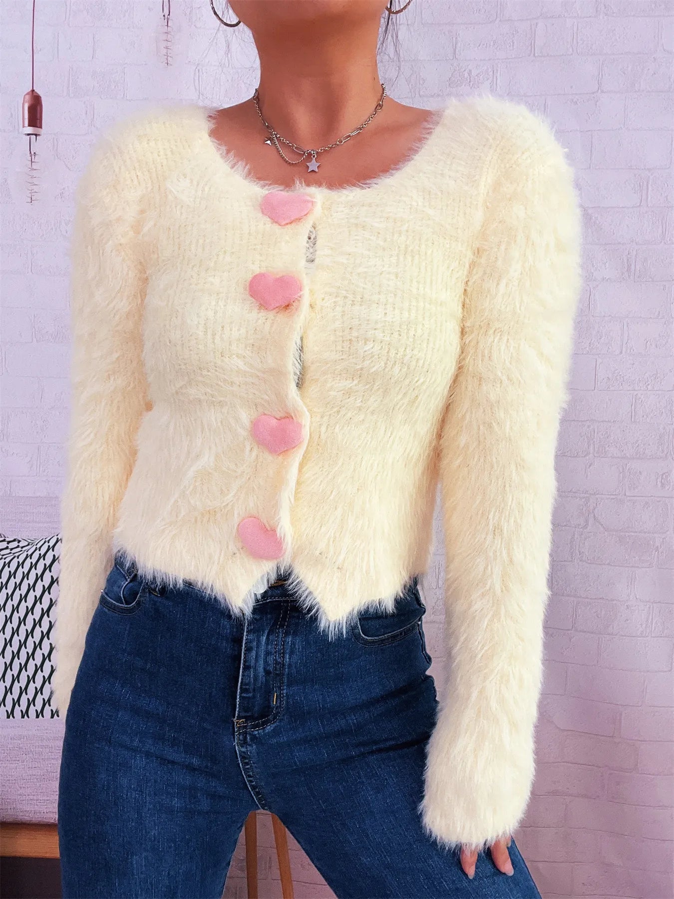 Trendsi Cozy Knit Sweater cream fuzzy cropped cardigan with pink heart buttons long sleeves styled with jeans