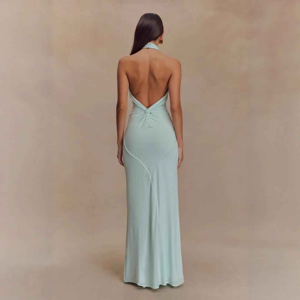Elegant Formal Gown in light mint green with a stunning back design and halter neck