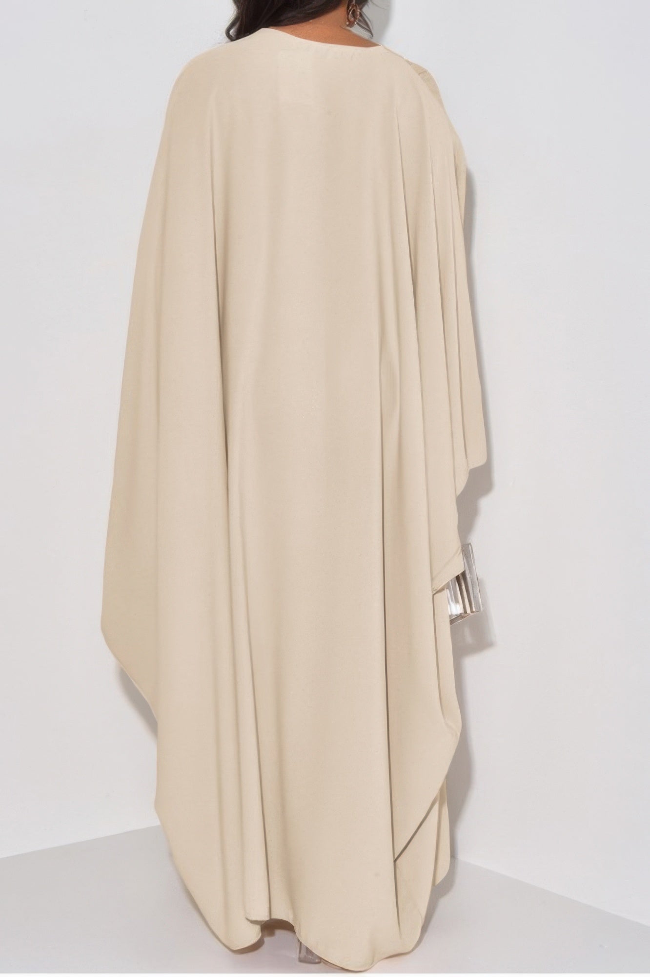 Beige loose fit v neck maxi dress back view with draped cape sleeves and floor length