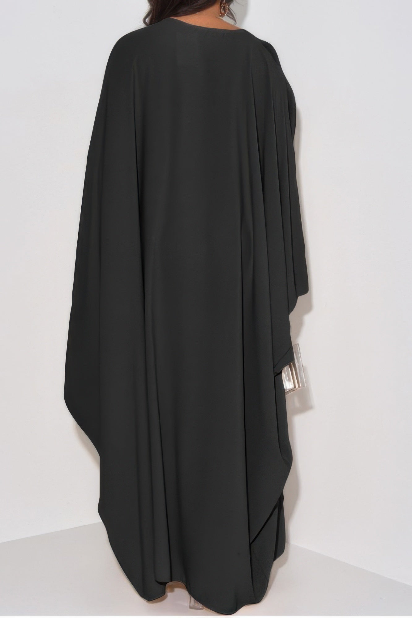 CCWHOLESALECLOTHING black draped back view of loose fit v neck maxi dress with long sleeves and silver clutch