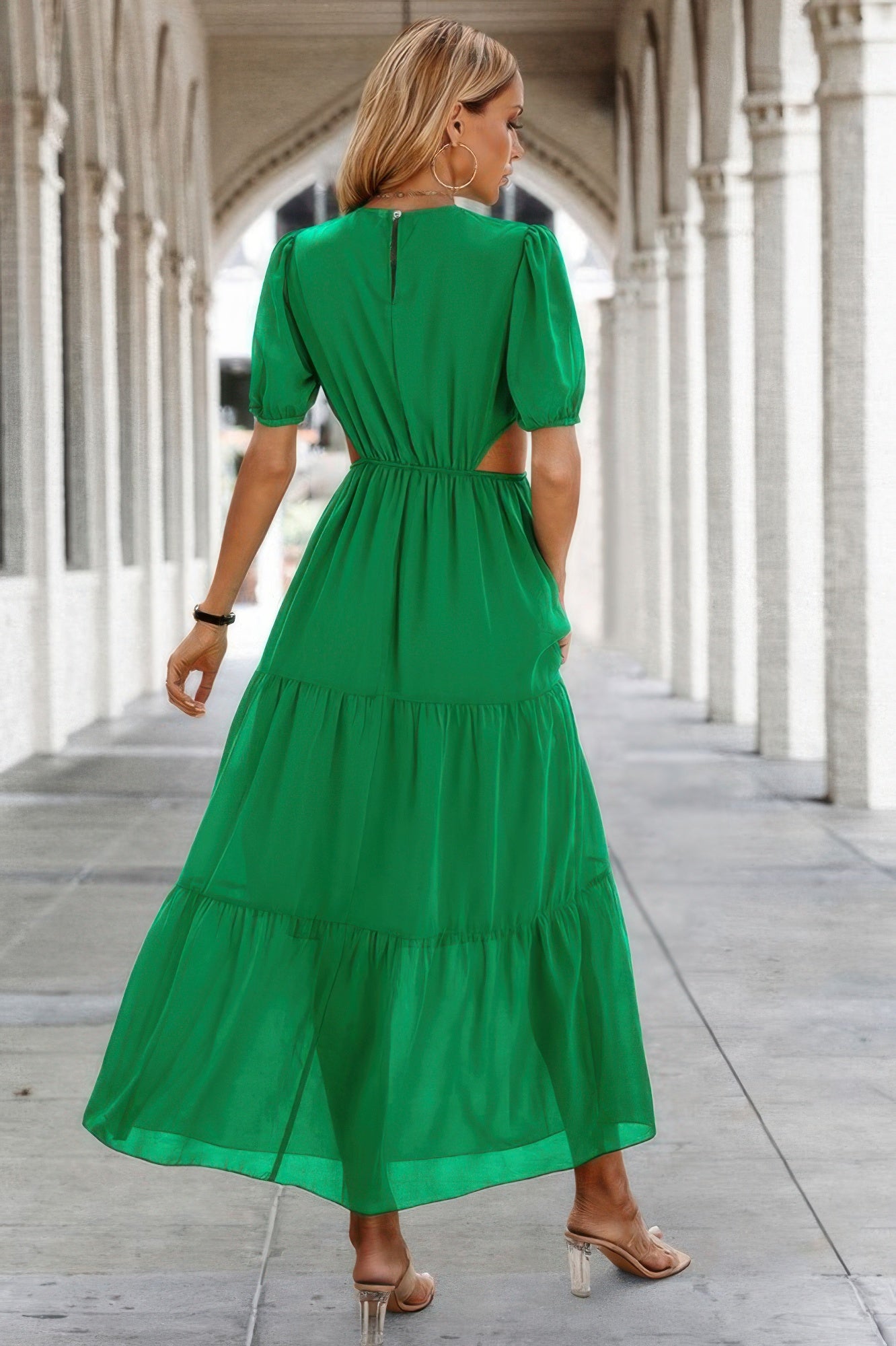 Puff Sleeves Fit Dress green tiered maxi dress with waist cutouts and back keyhole, model walking in archway