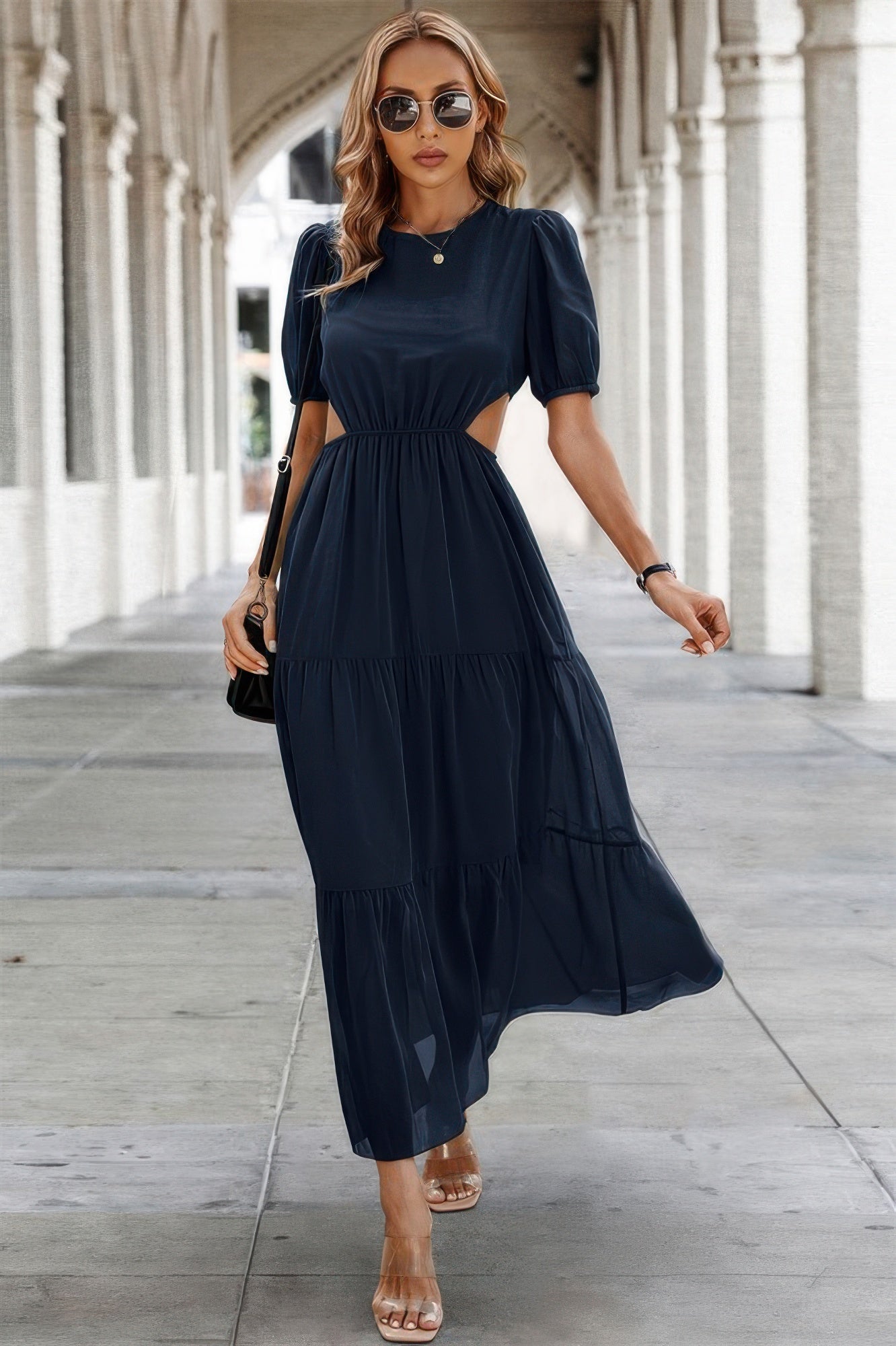 Women wearing navy maxi Puff Sleeves Fit Dress with waist cutouts tiered skirt sunglasses and sandals