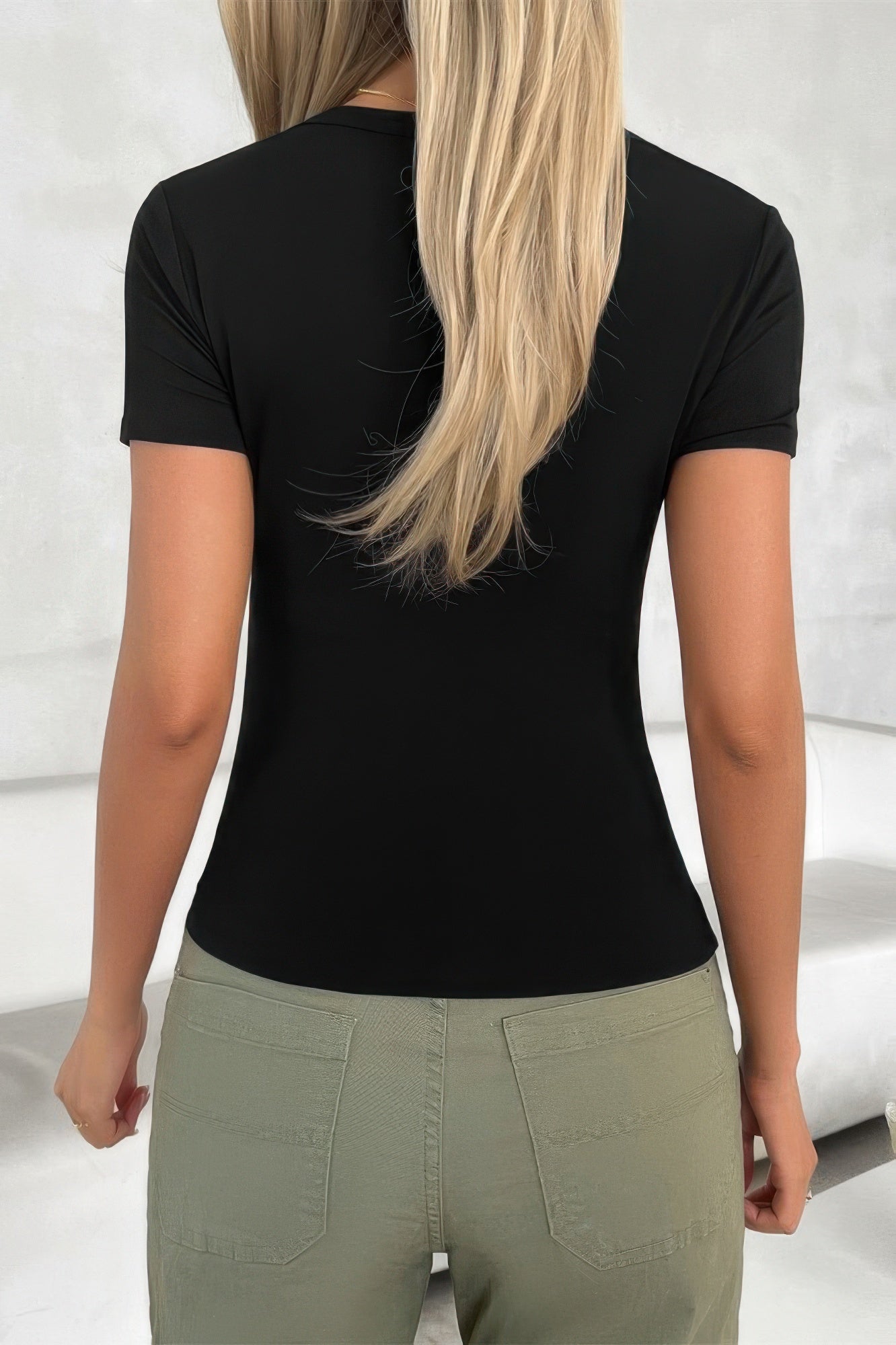 CCWHOLESALECLOTHING solid scoop neck t shirt in black shown from back on model with short sleeves and fitted silhouette