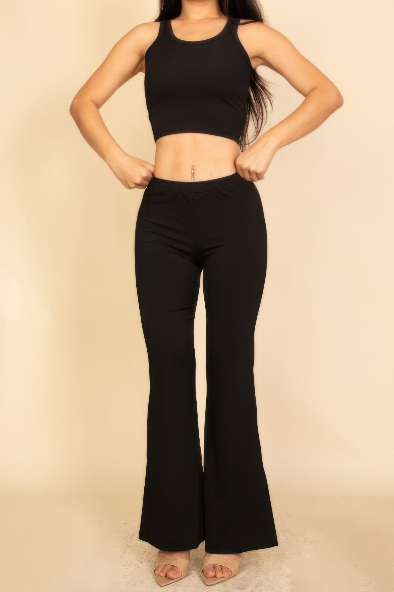 Stylish Flared Pants Set in Black featuring a fitted crop top and flared bottom pants