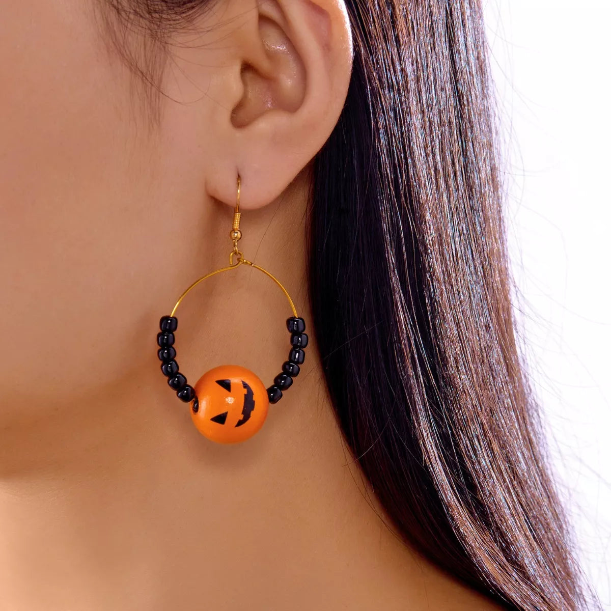 Halloween Bead Earrings with a pumpkin design and black beads for festive style