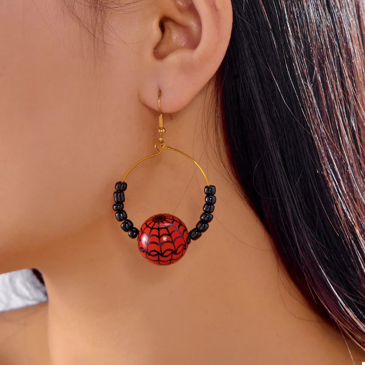 Trendsi Halloween Bead Earrings featuring a red spider web design and black beads for festive style