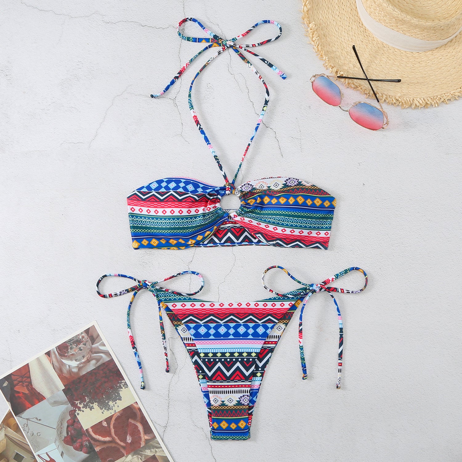 Trendsi Halter Split Self Tie Bikini with colorful geometric patterns styled with sunglasses and straw hat