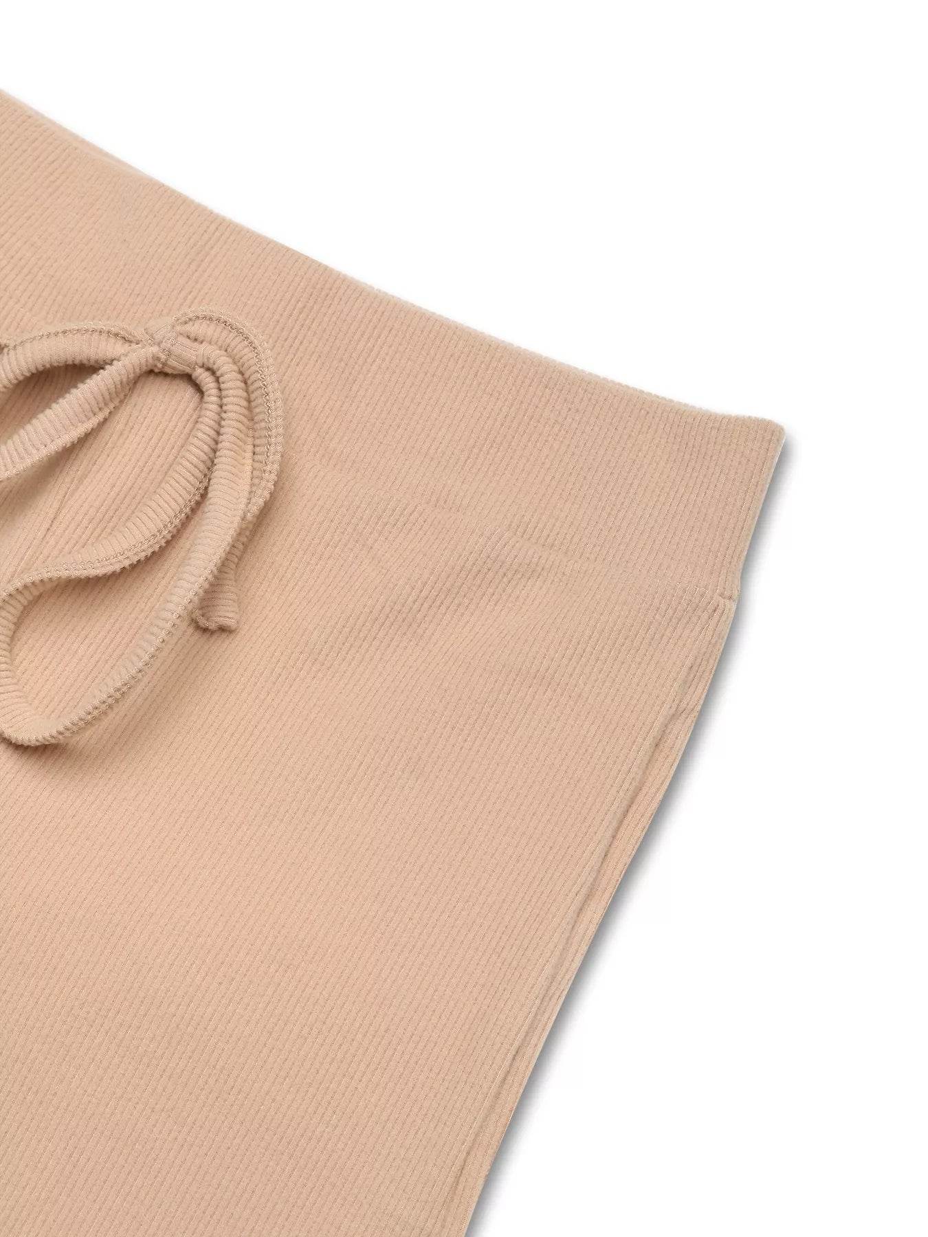 Close-up of beige drawstring pants from the Trendsi Hoodie and Pants Set with textured fabric