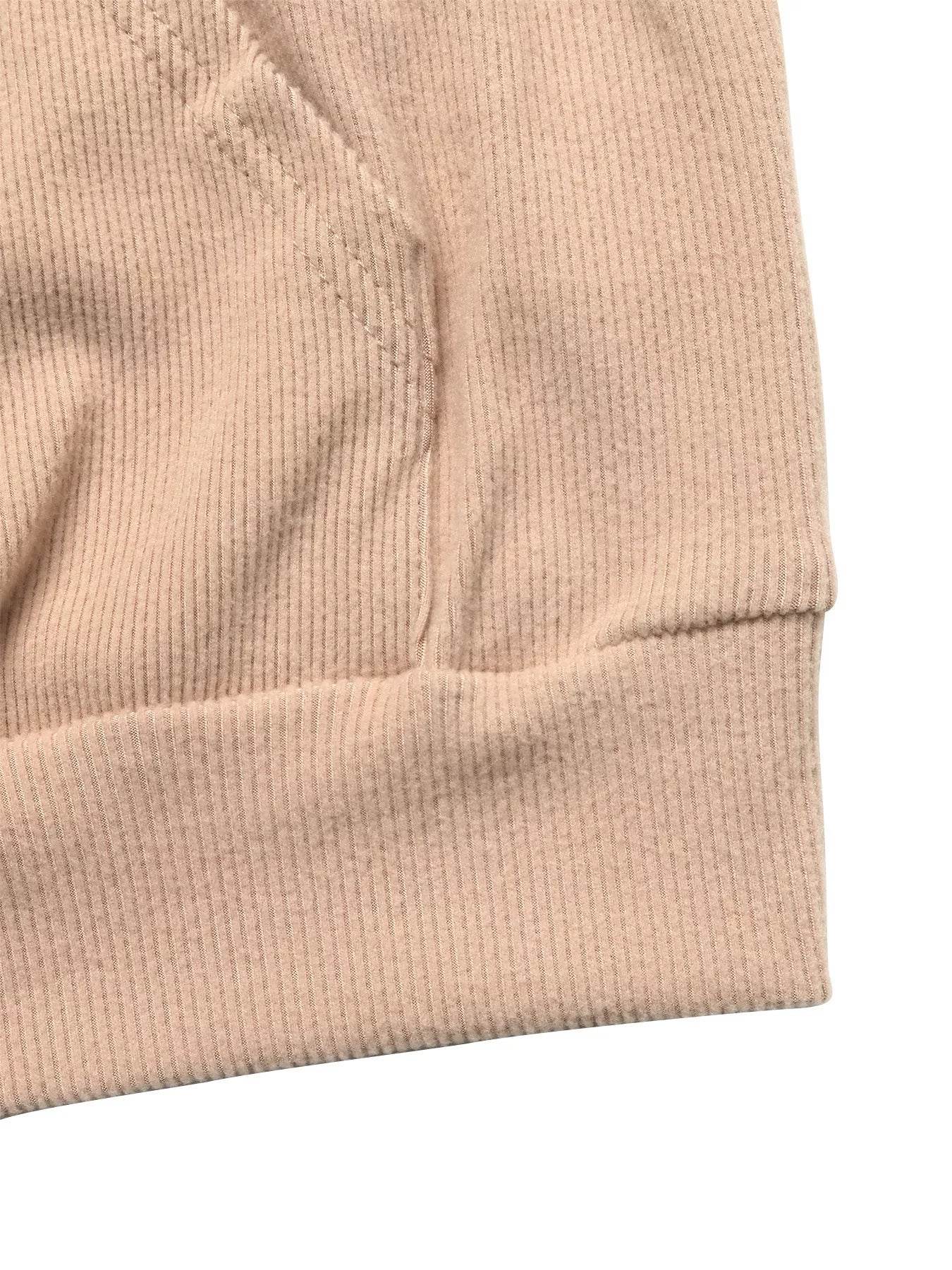 Close-up of a soft fabric detail from a trendy Hoodie and Pants Set in a light beige color