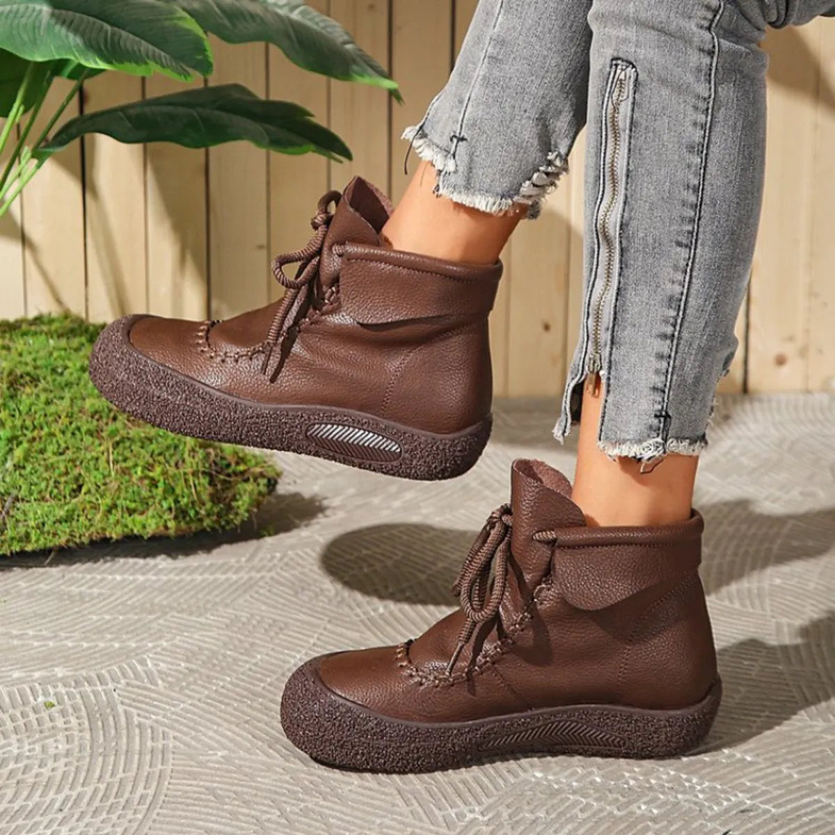 Trendsi brown lace-up casual ankle boots worn with gray zippered skinny jeans outdoors