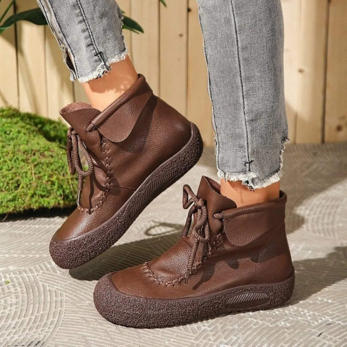 Trendsi brown lace-up casual ankle boots with textured soles paired with grey distressed jeans