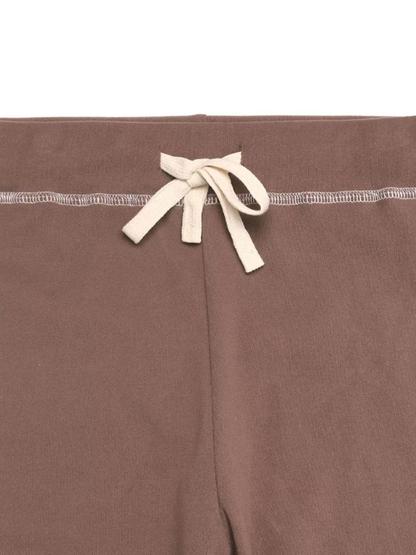 Trendsi Long Sleeve Top and Pants Set featuring a stylish waistband with a bow detail