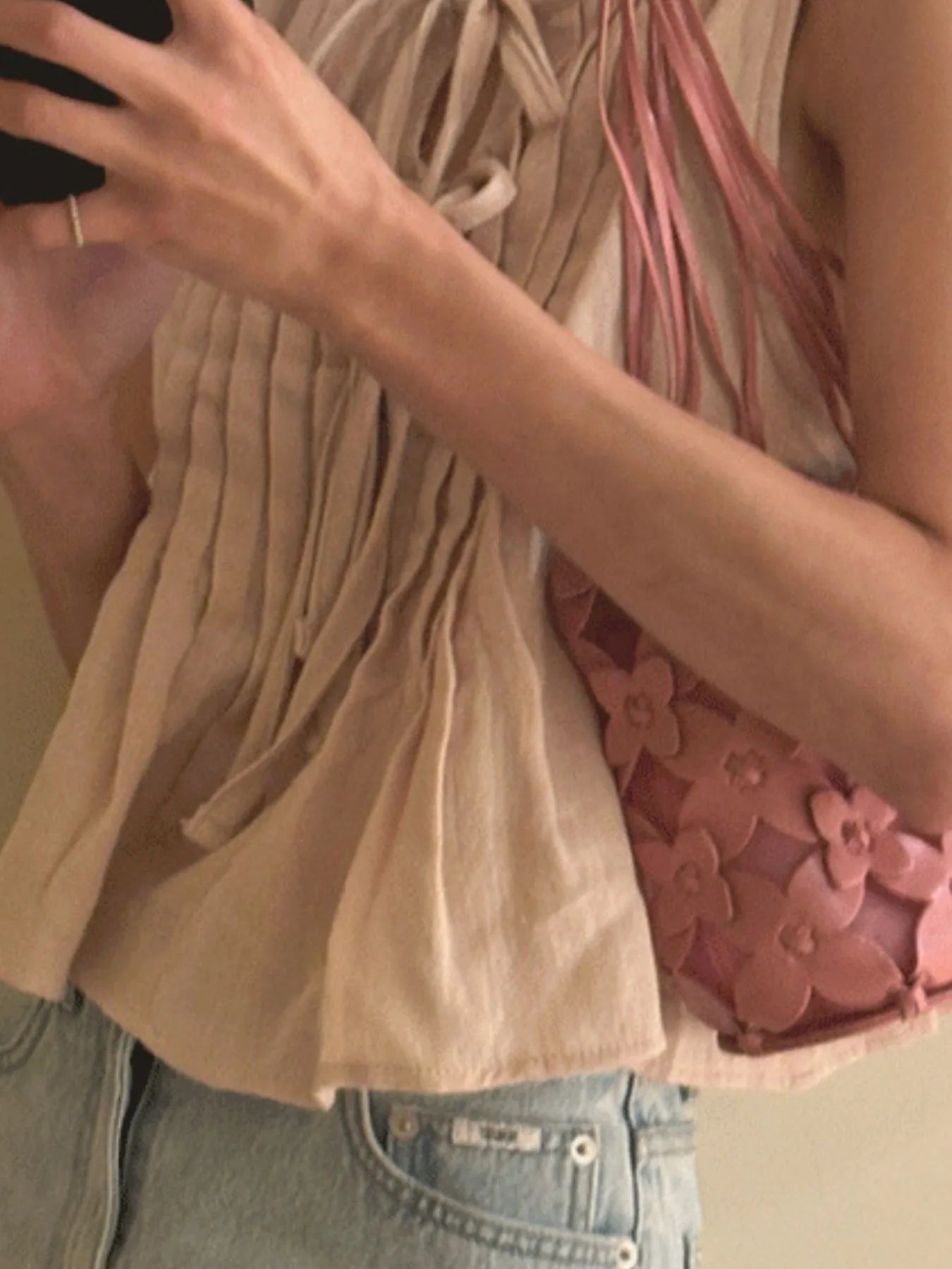 Trendsi beige Sleeveless Summer Blouse pleated front tie neckline with light wash jeans and pink floral bag