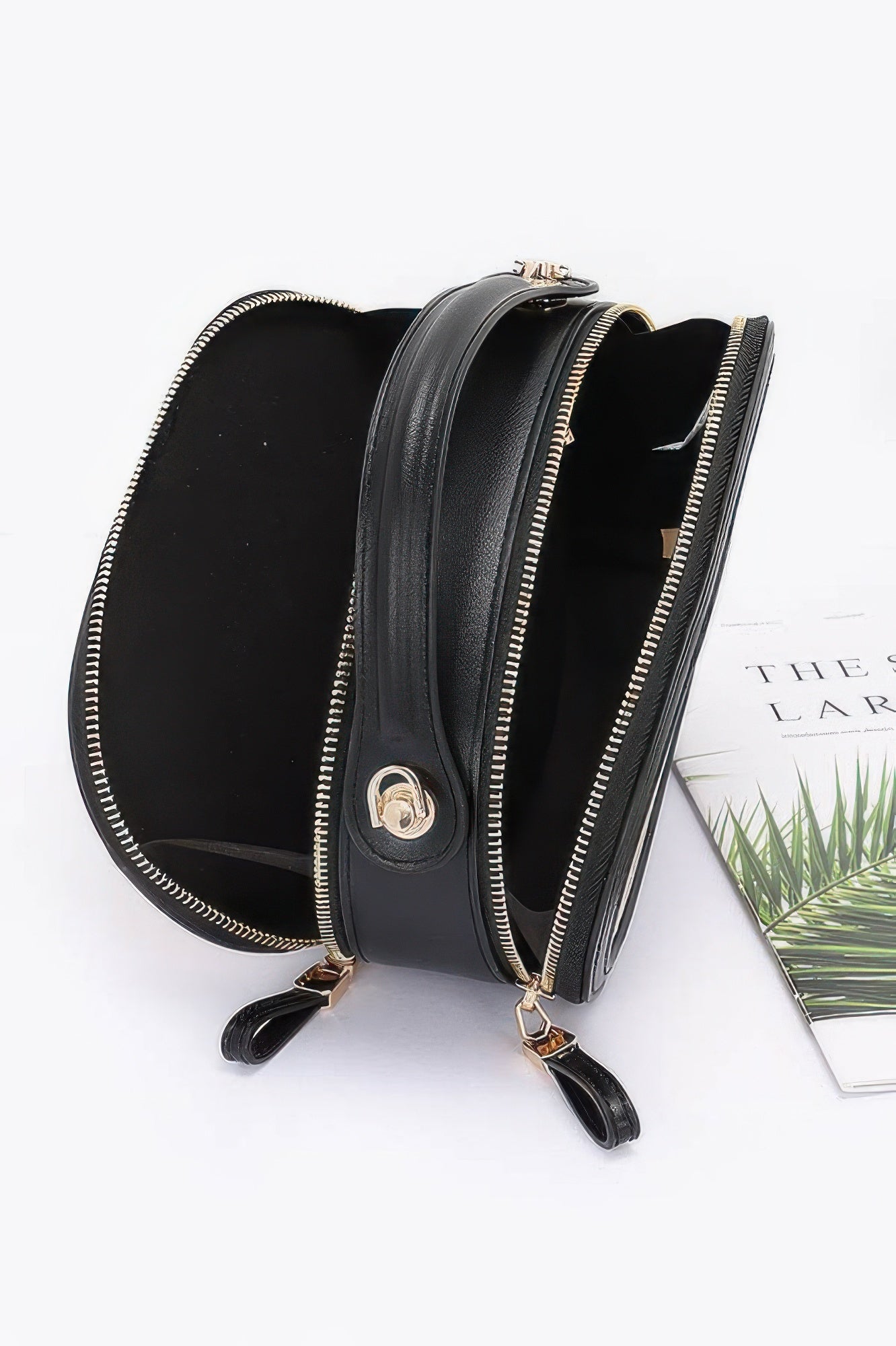 Black round faux leather crossbody with gold zippers and interior pockets faux straw bowling bag for casual outings