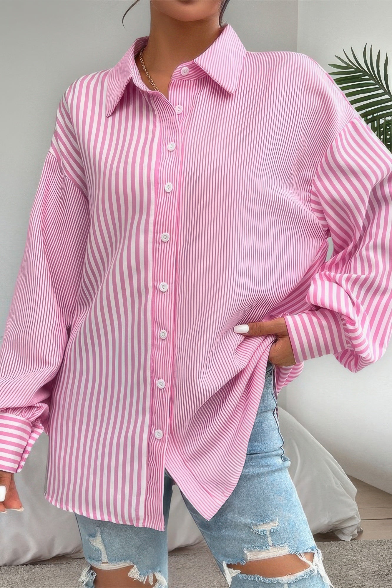 CCWHOLESALECLOTHING pink oversized stripe print button down shirt with long sleeves styled with ripped jeans