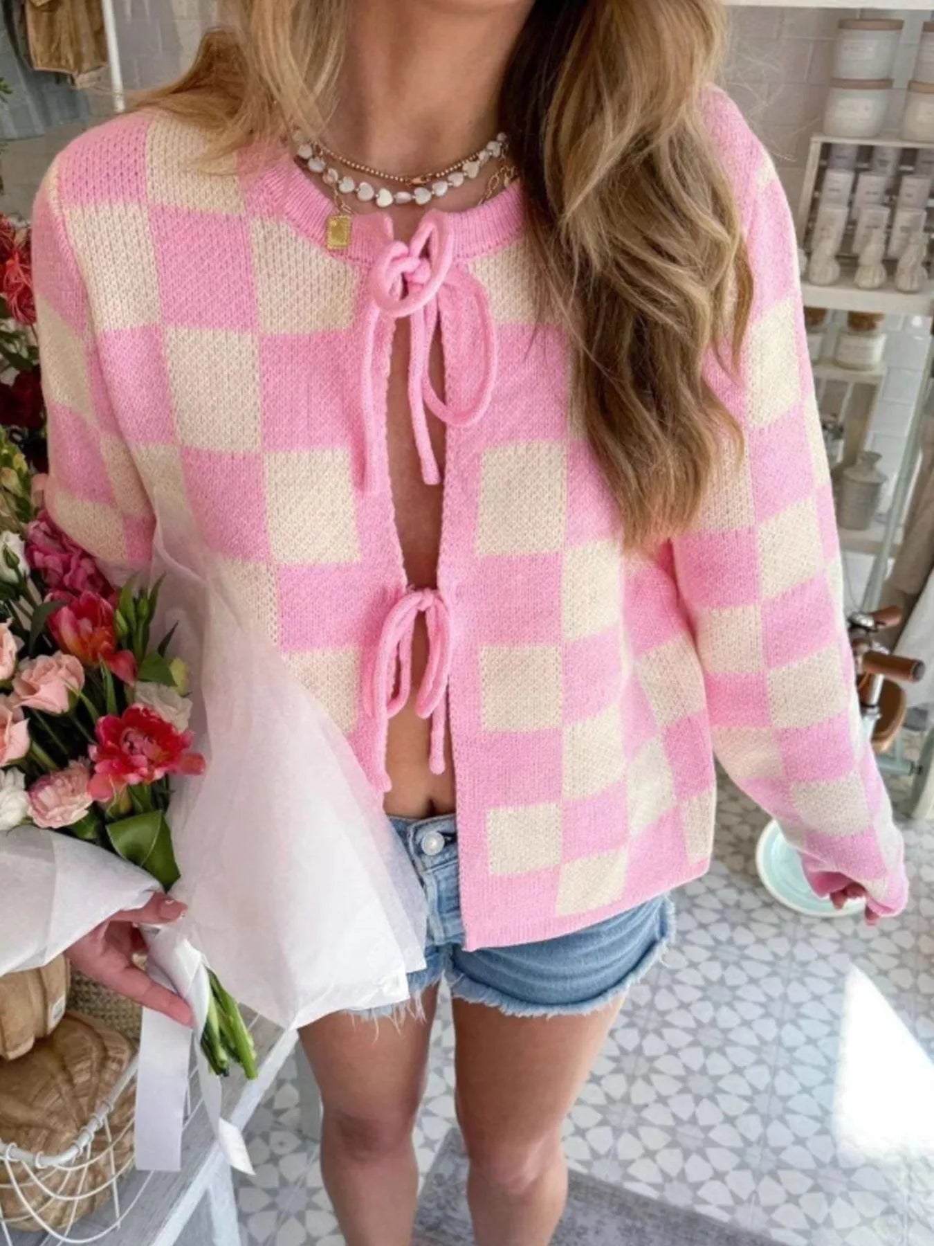 Tie-Front Cropped Cardigan pink and cream checkerboard knit with long sleeves worn with denim shorts