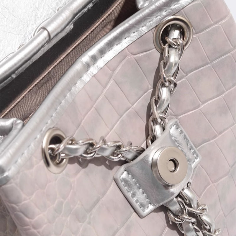 Trendsi Metallic Mini Backpack close up silver croc embossed exterior chain strap grommet and snap closure