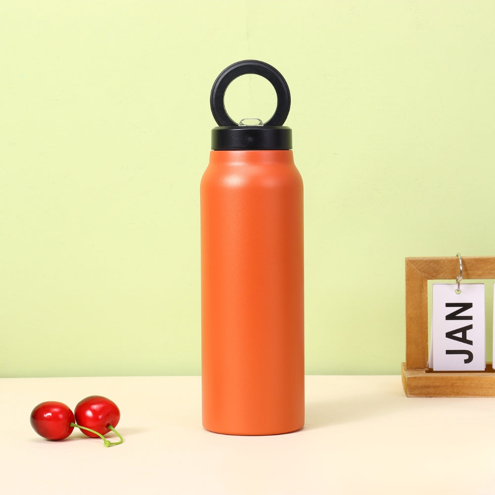 Fashions Envy orange insulated water bottle with loop cap on desk styled as product image for Magnetic Phone Holder category