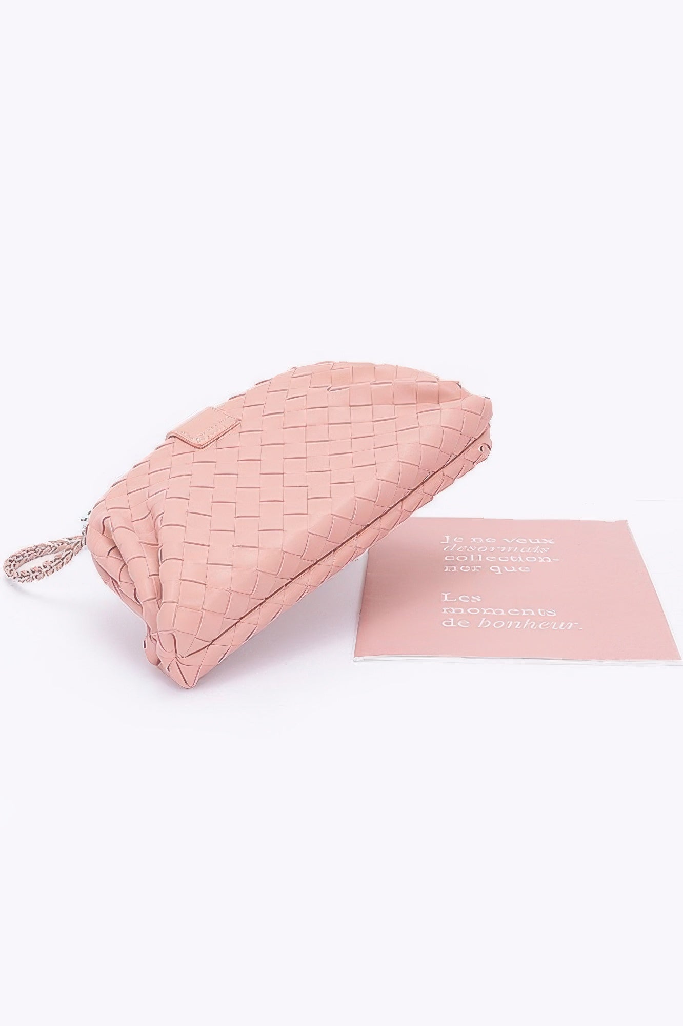 Blush pink faux leather braided shoulder bag clutch with woven texture and braided wrist strap for casual wear
