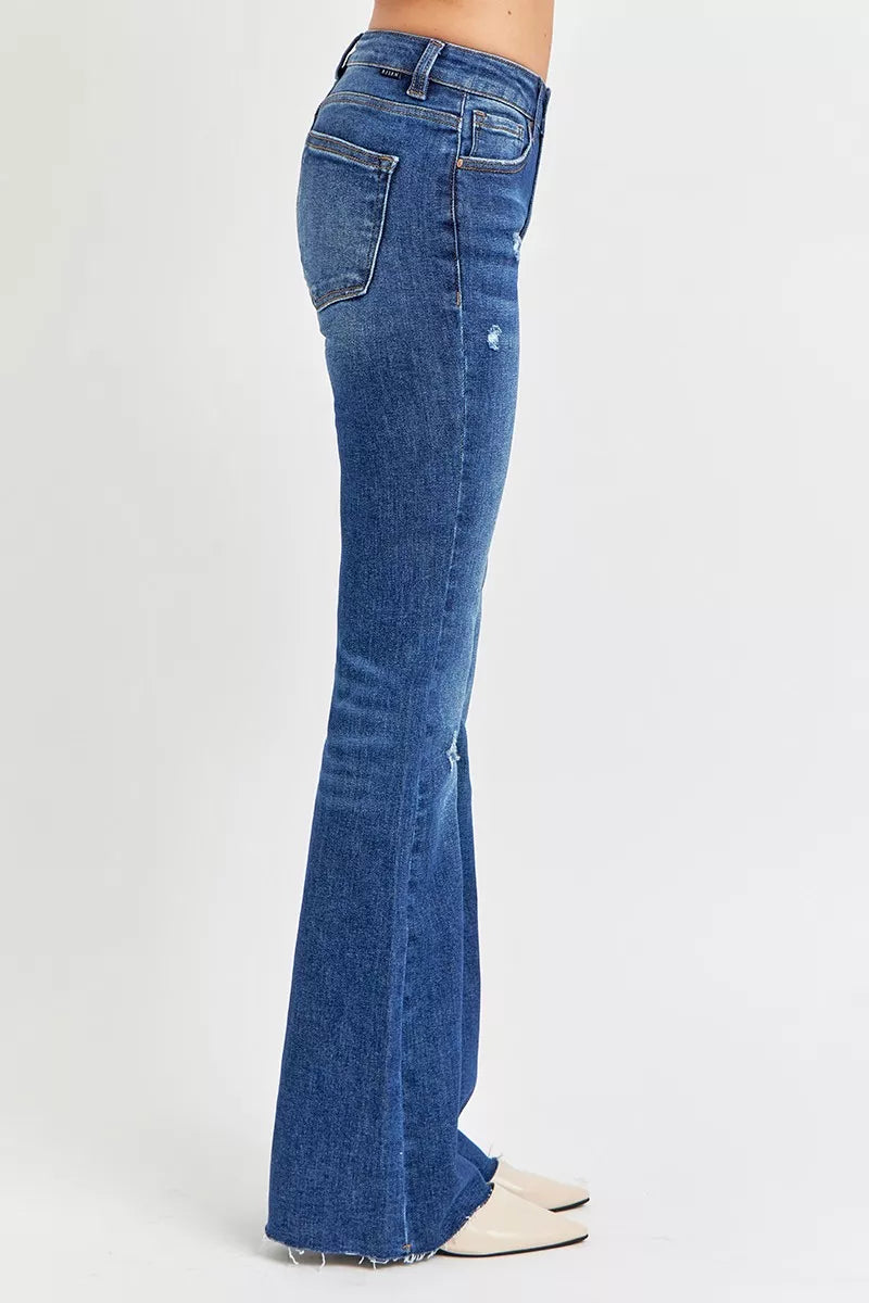 Stylish side view of Mid Rise Flare Jeans in blue denim with a distressed finish and tailored fit