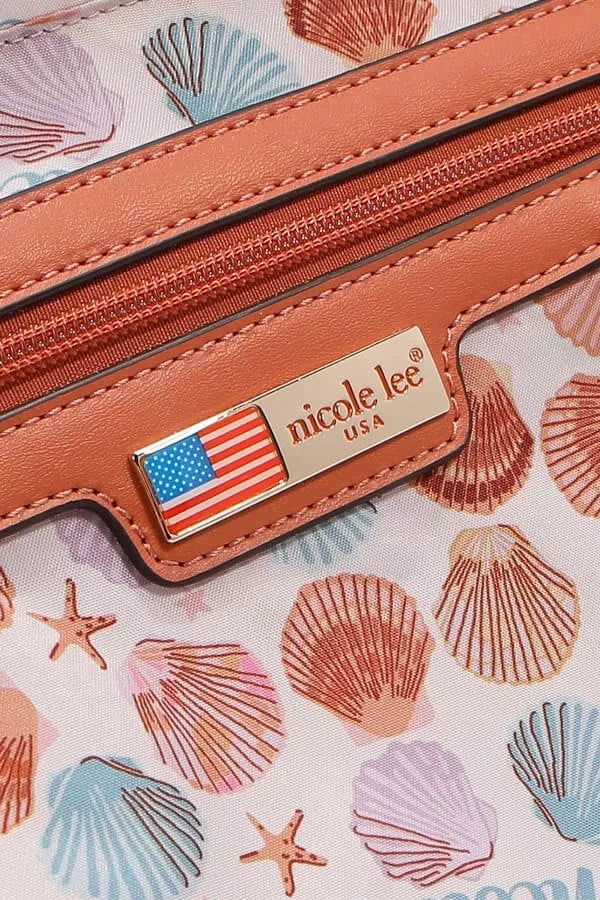 Close-up of a Sand Hobo Handbag with seashell design and Nicole Lee logo detailing