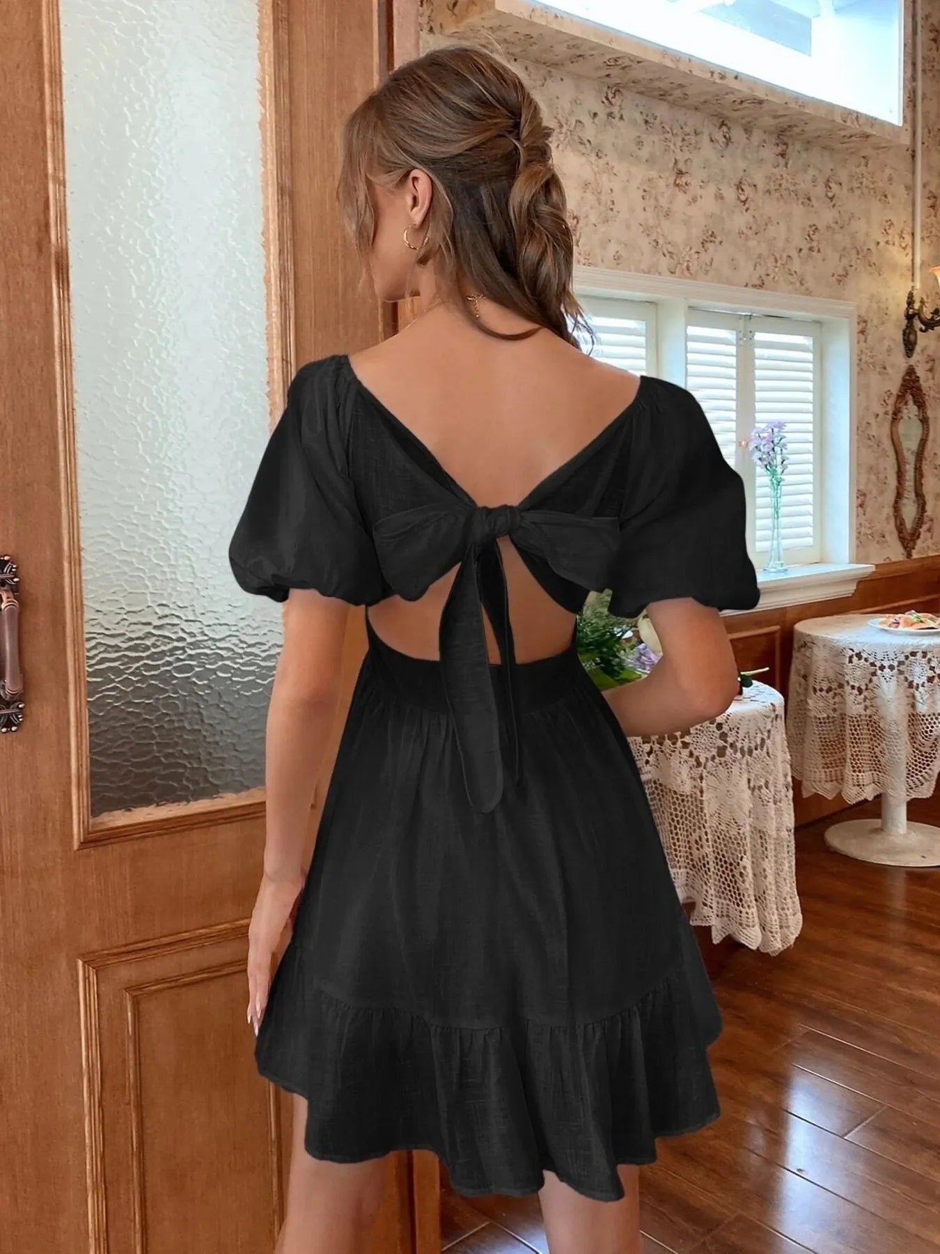 Black Puff Sleeve Mini Dress with Back Tie Detail for a Stylish and Elegant Look