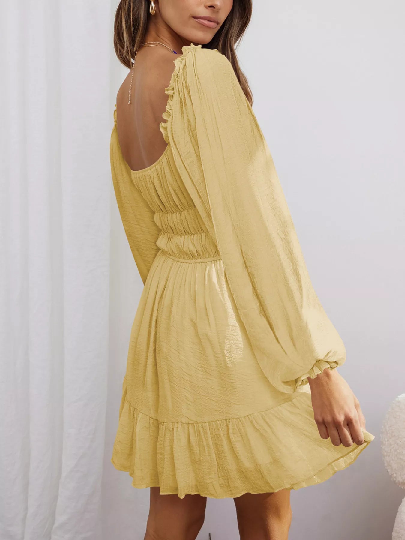 Trendsi Romantic Flowy Dress in yellow with ruffled hem and long sleeves for a stylish look
