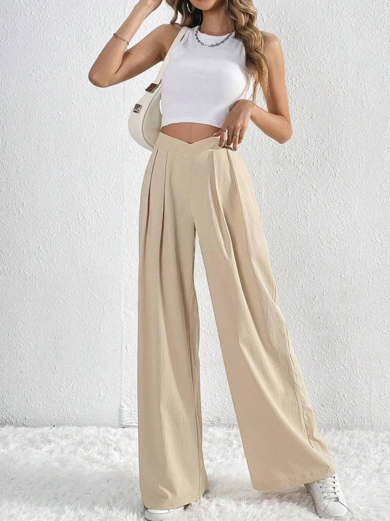 Trendsi Ruched Pants in beige with a relaxed fit, styled with a white crop top and sneakers
