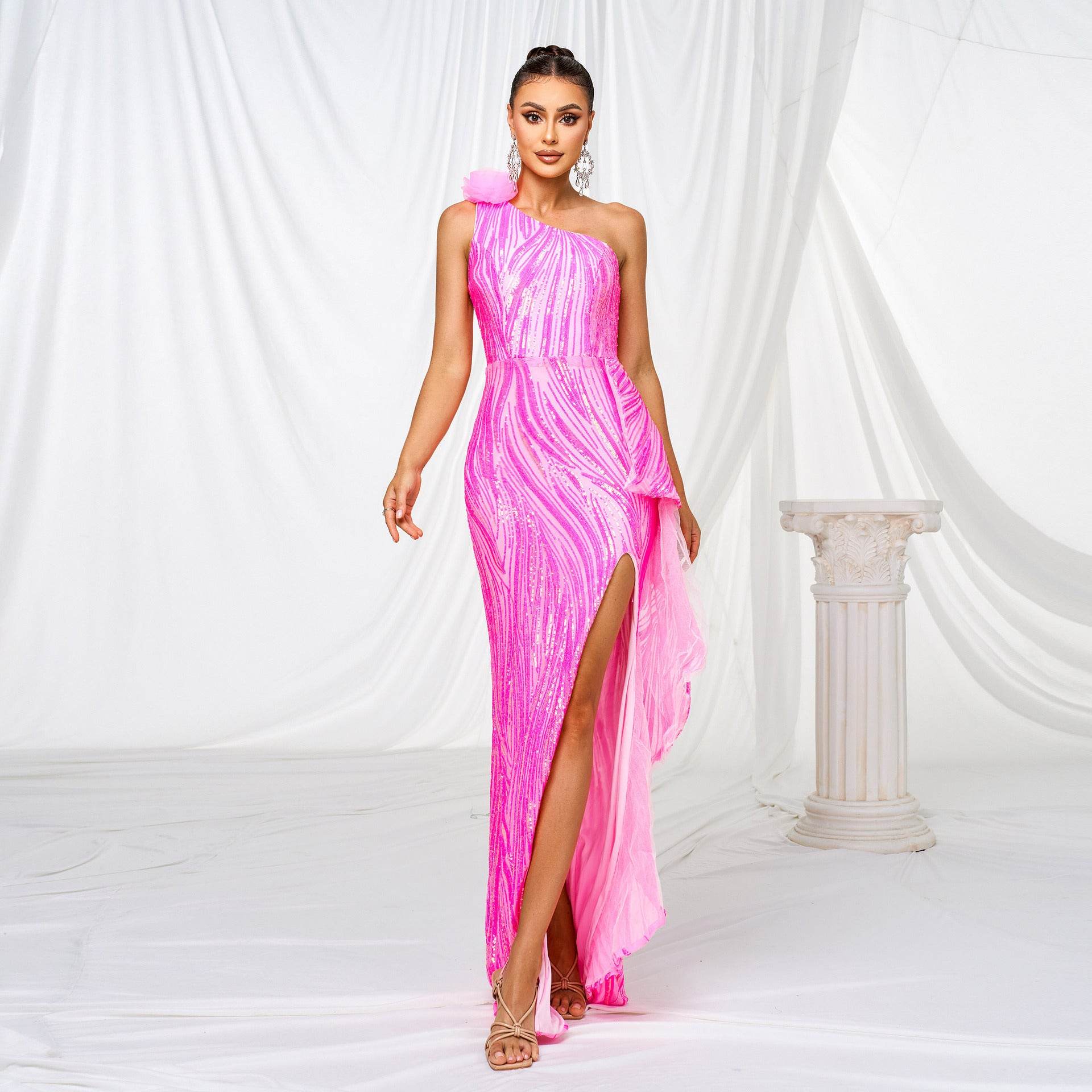 Stunning pink sequined slit wedding dress featuring a one-shoulder design and flowing silhouette