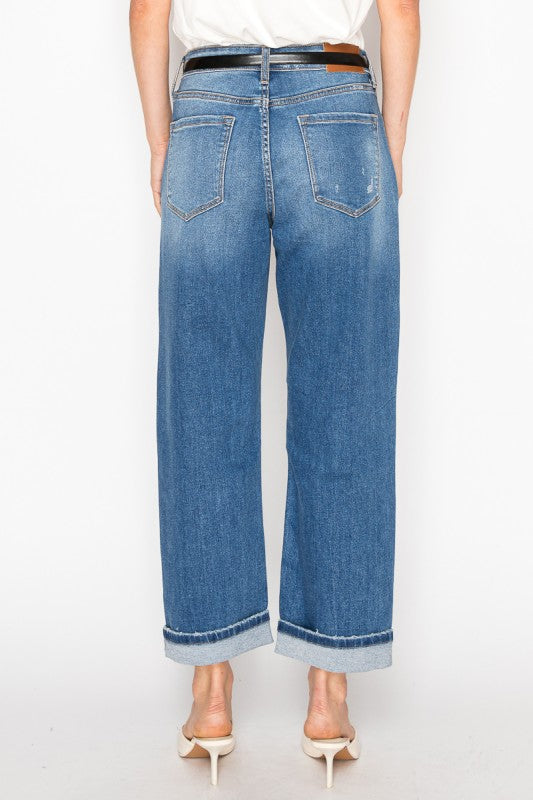 Artemis Vintage women's hybrid high rise jeans back view cuffed light wash wide leg with belt and heels
