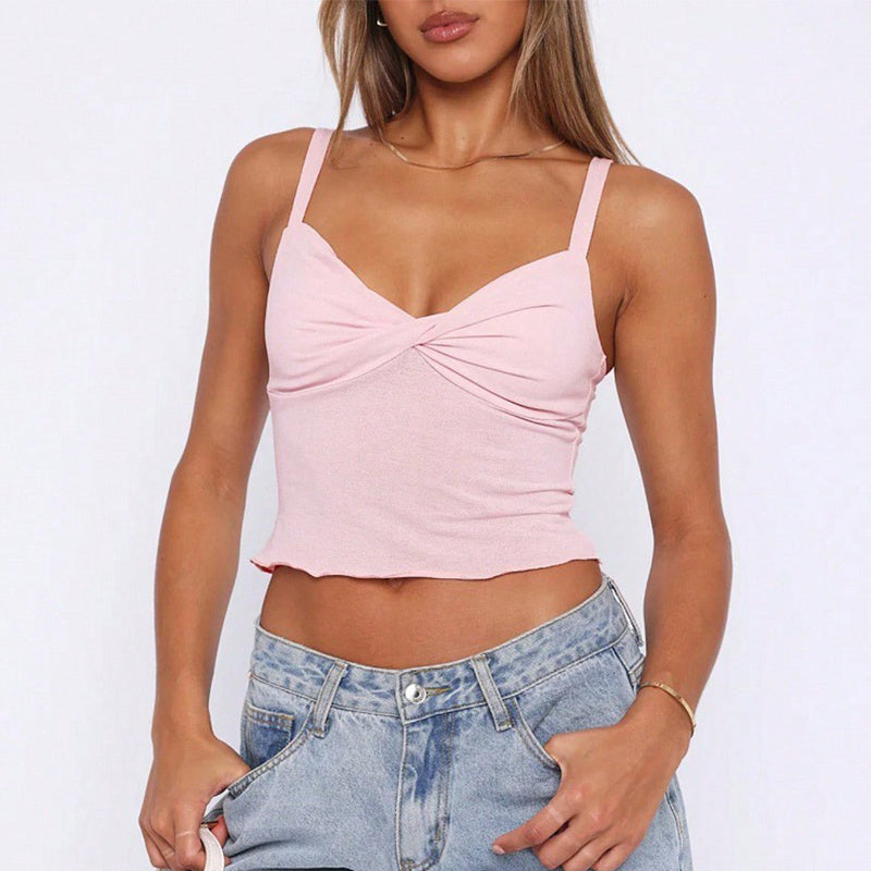 Trendsi pink Y2K V-neck camisole top on model with twist front cropped scalloped hem and light wash jeans