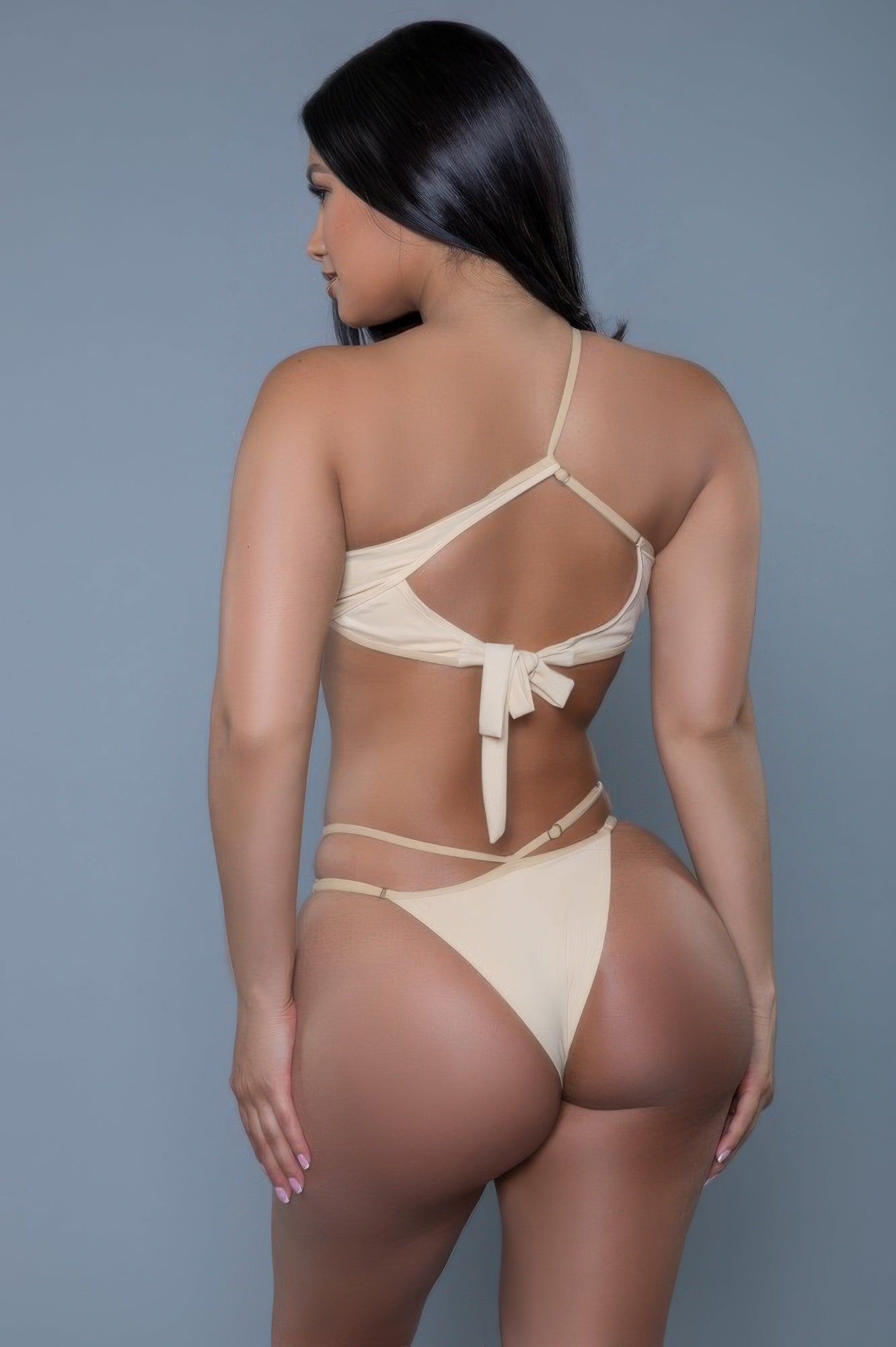 Model back view wearing strappy brown bikini set with tie back and cutout straps by CCWHOLESALECLOTHING